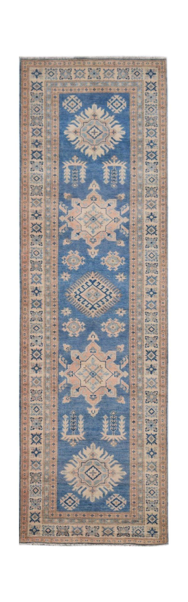 Handmade Afghan Kazakh runner rug featuring geometric medallions in blue and beige tones.