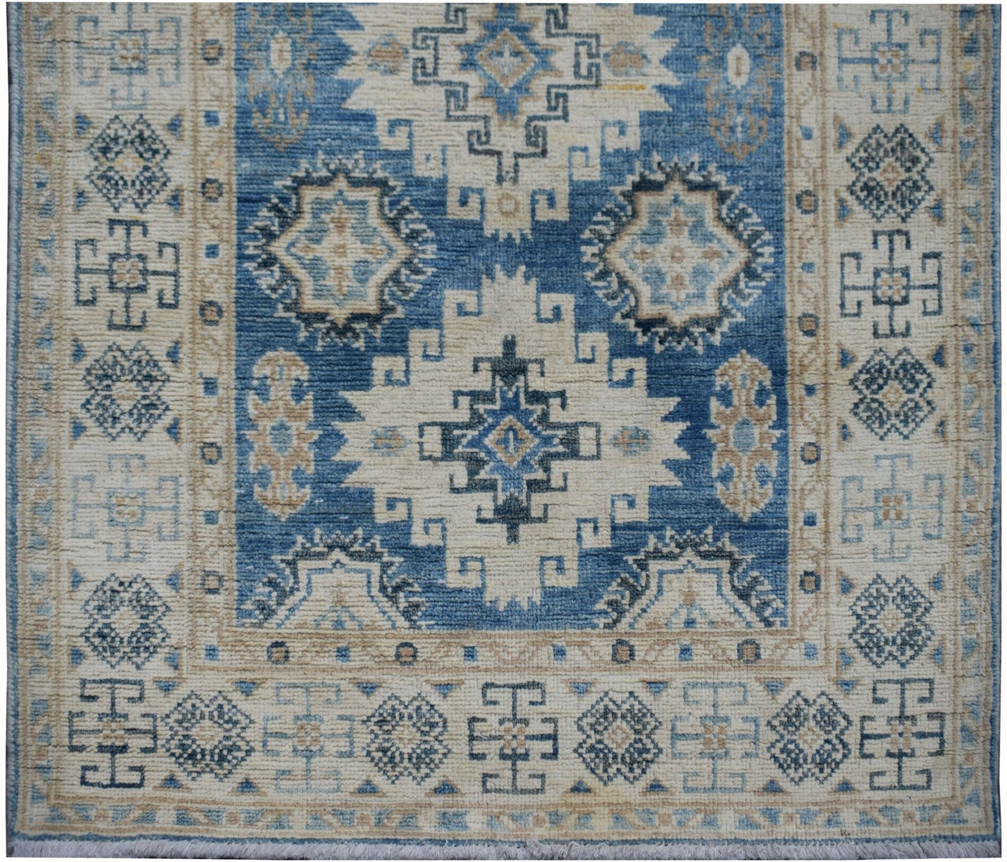 Handmade Afghan Kazakh runner rug featuring geometric patterns in shades of blue, beige, and grey.