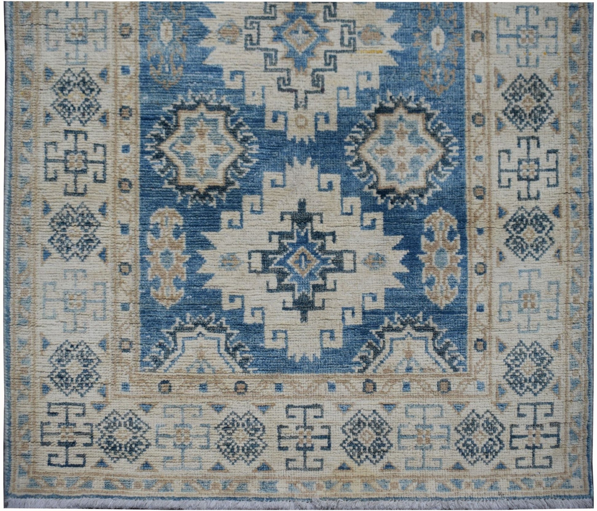 Handmade Afghan Kazakh runner rug featuring geometric patterns in shades of blue, beige, and grey.