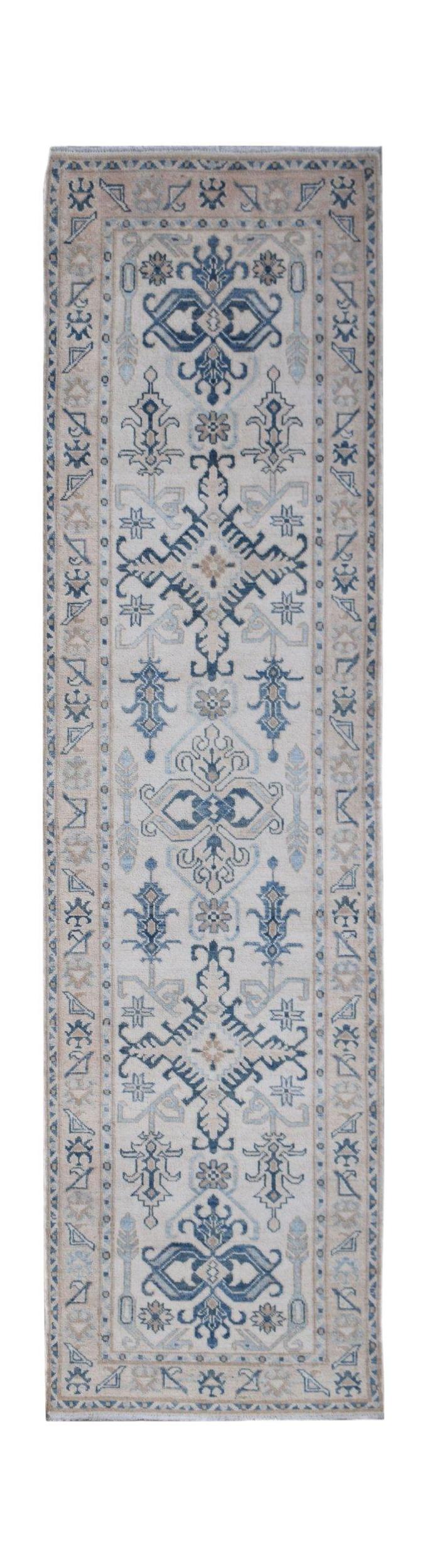 A handmade Afghan Kazakh runner rug featuring traditional blue and beige geometric patterns.