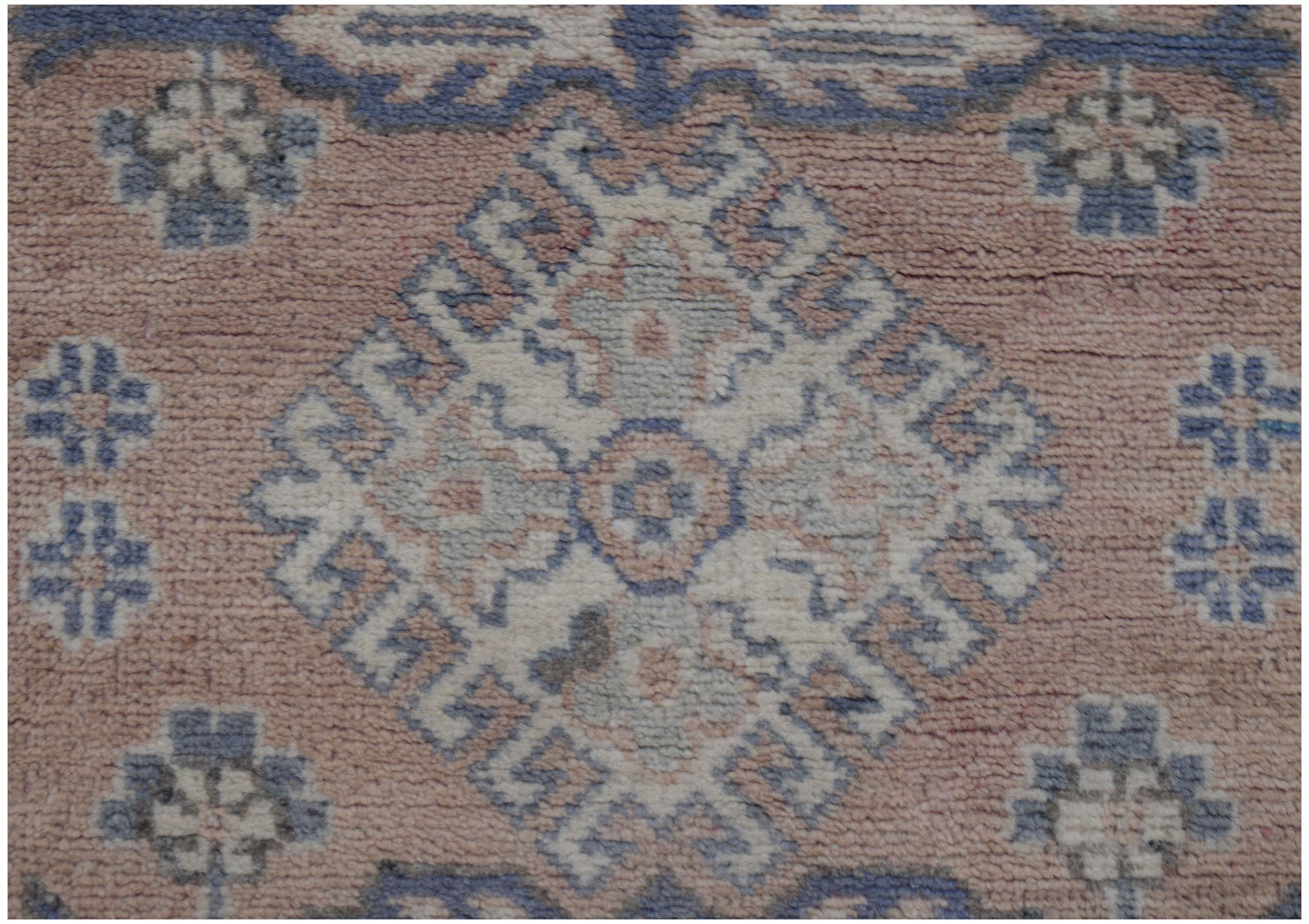 Handmade Afghan Kazakh runner rug featuring a geometric diamond medallion in blue and cream tones.