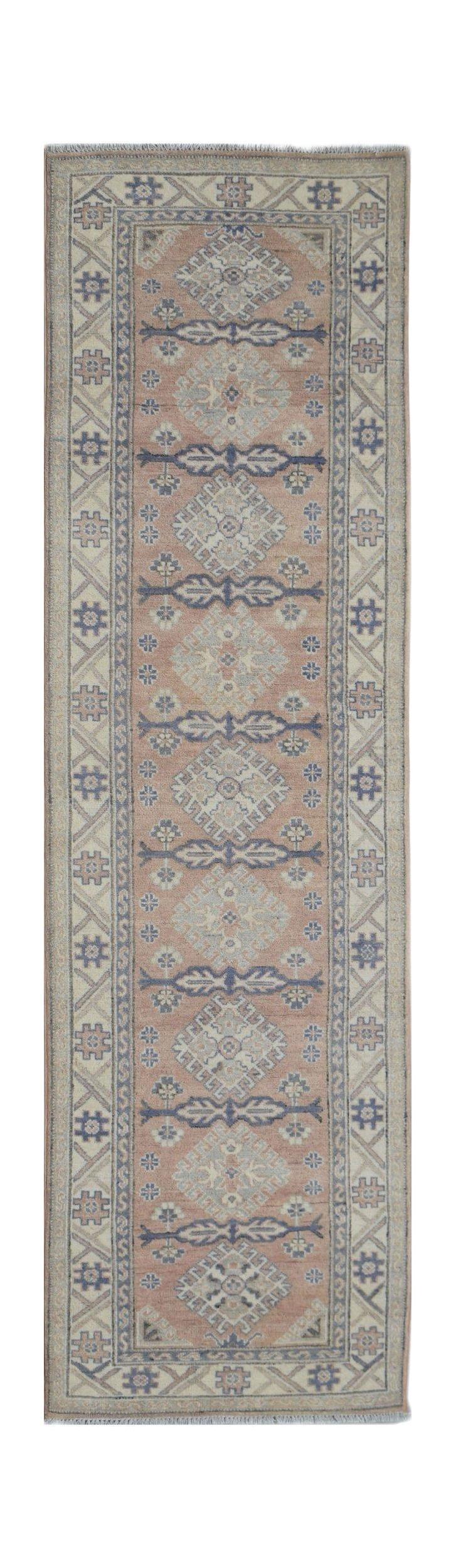 A handmade Afghan Kazakh runner rug featuring traditional geometric motifs in blue and dusty pink.