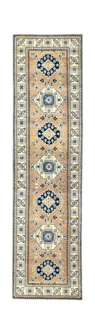 A handmade Afghan Kazakh runner rug featuring a beige field with repeating blue geometric medallions.