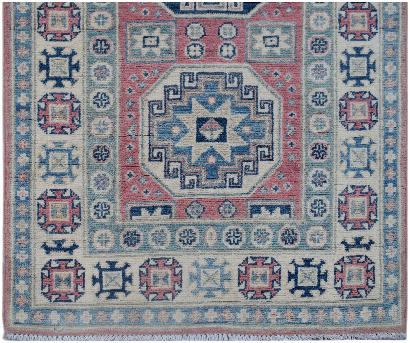 Handmade Afghan Kazakh runner rug featuring traditional geometric motifs in pink, blue, and cream.