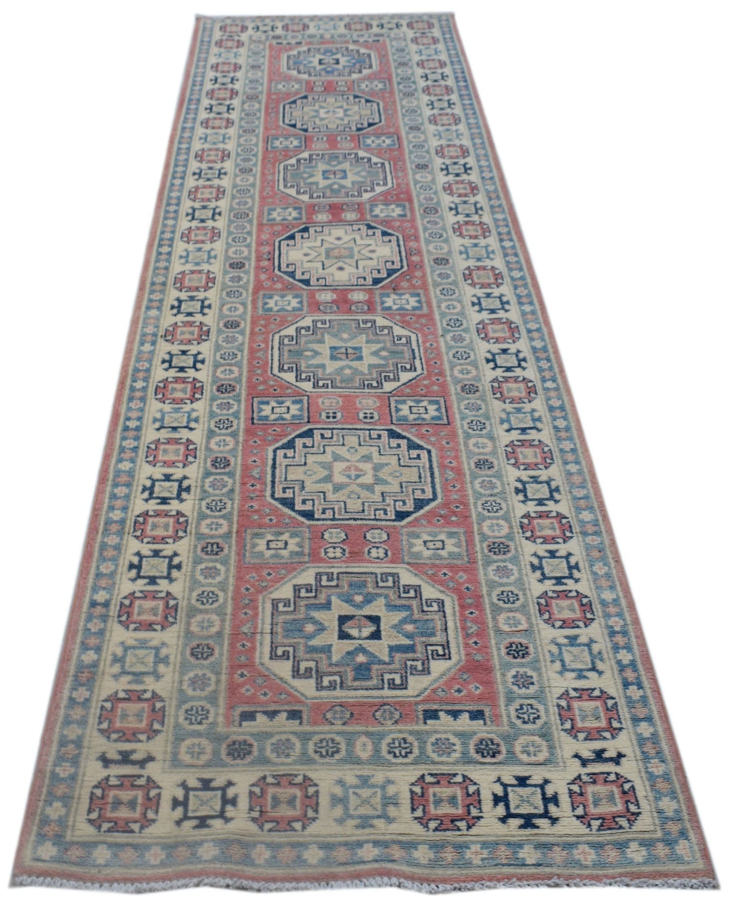 A handmade Afghan Kazakh runner rug featuring traditional geometric motifs in blue, red, and cream.