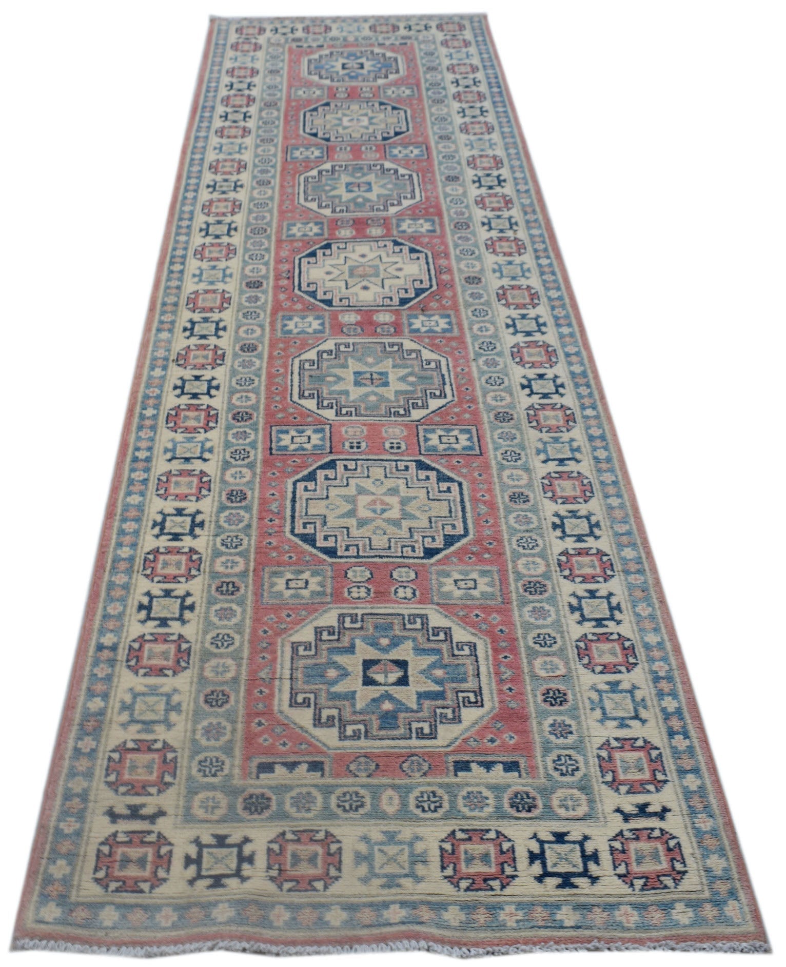 A handmade Afghan Kazakh runner rug featuring traditional geometric motifs in blue, red, and cream.
