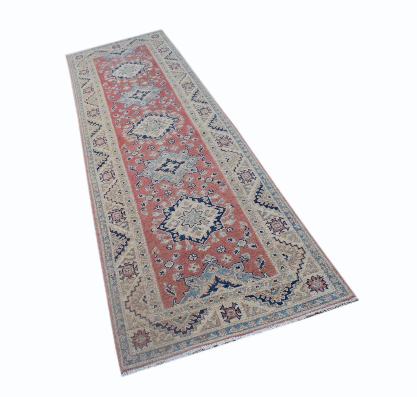 A handmade Afghan Kazakh runner rug featuring traditional geometric motifs in red, blue, and cream.