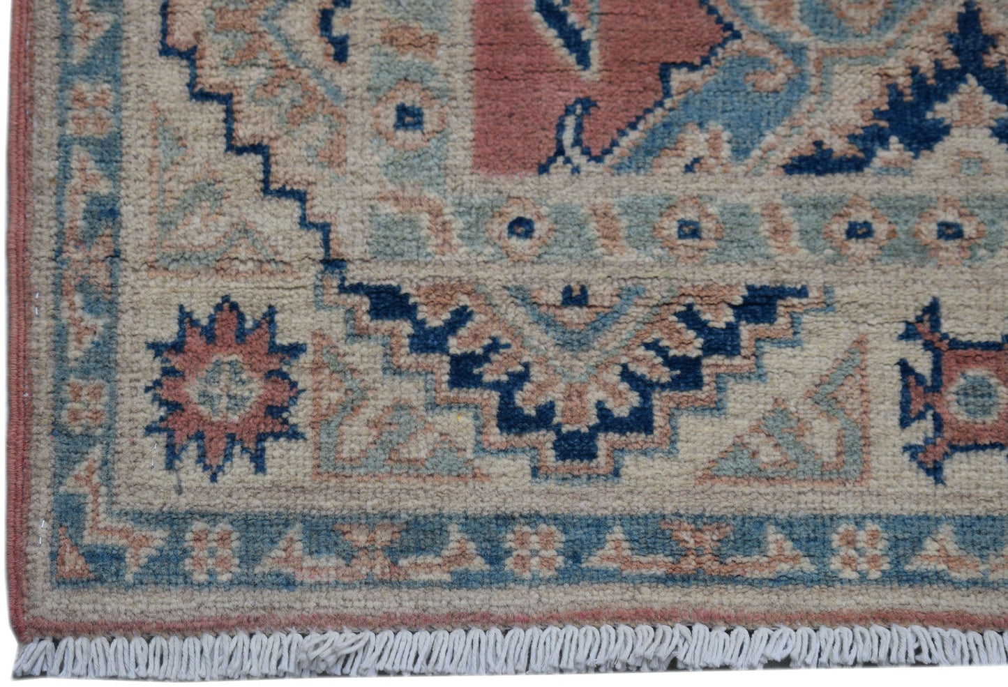 Handmade Afghan Kazakh runner featuring traditional geometric motifs in blue, pink, and cream.