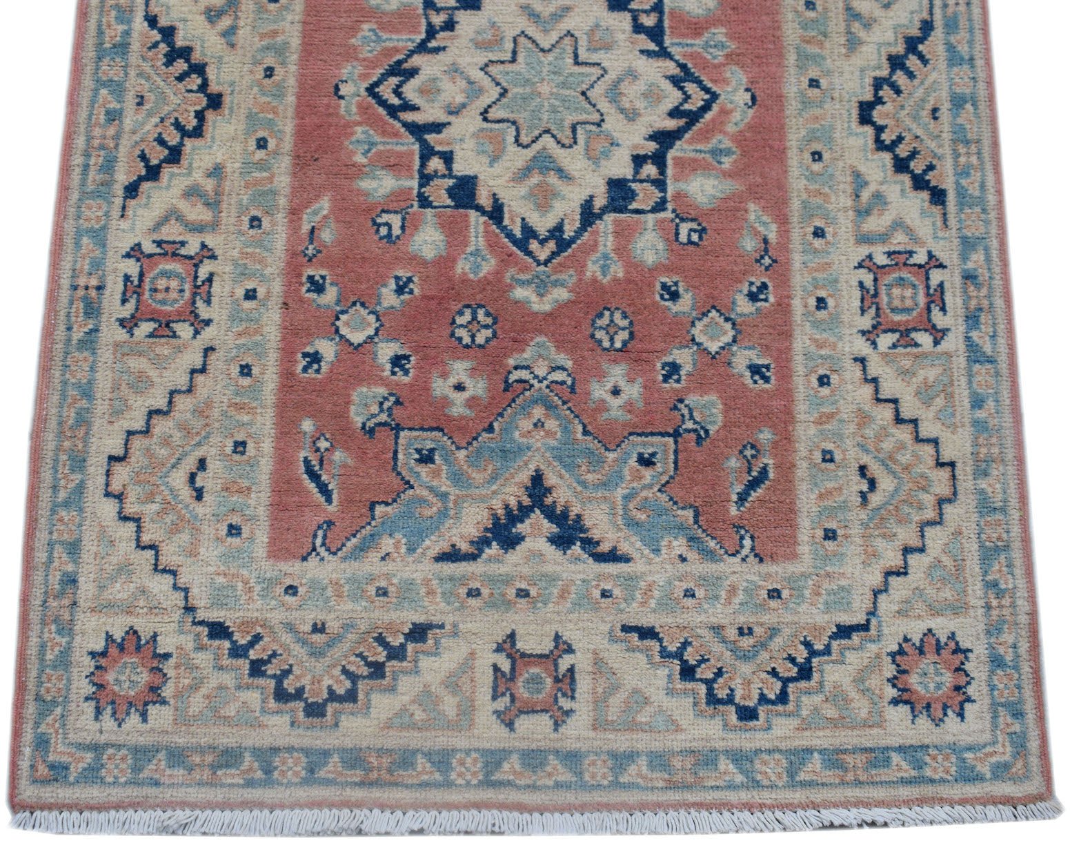 Handmade Afghan Kazakh runner rug featuring traditional geometric motifs in red, blue, and cream.