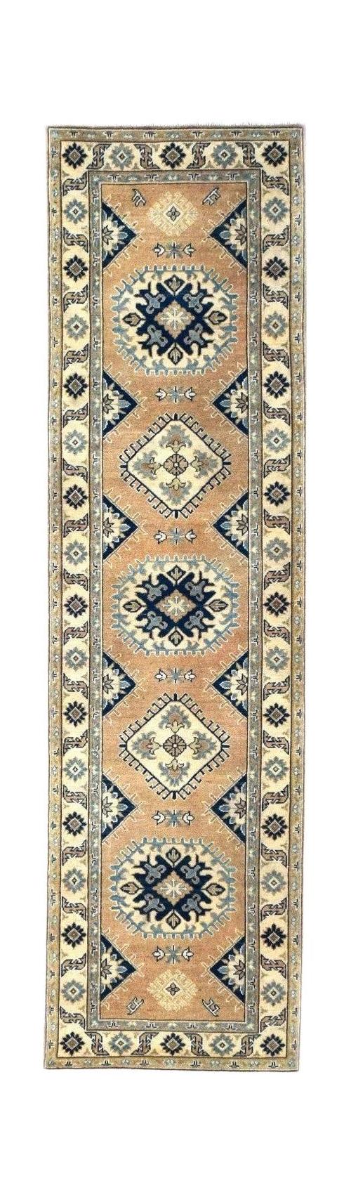 Handmade Afghan Kazakh runner rug featuring a beige field with blue and grey geometric medallions.