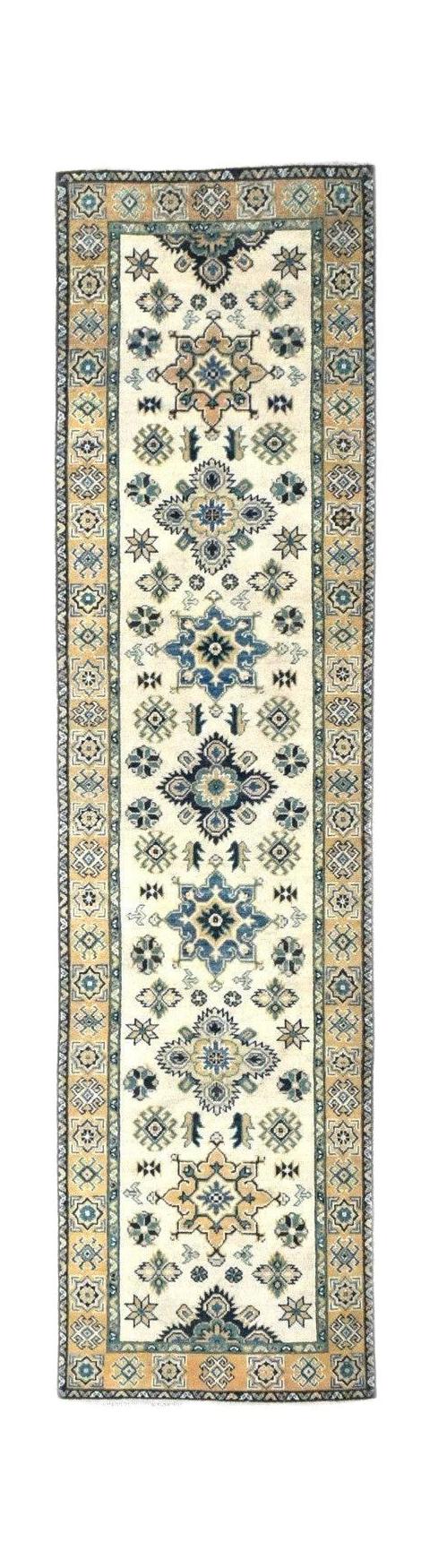 Handmade Afghan Kazakh runner rug featuring a beige field with blue and grey geometric motifs.