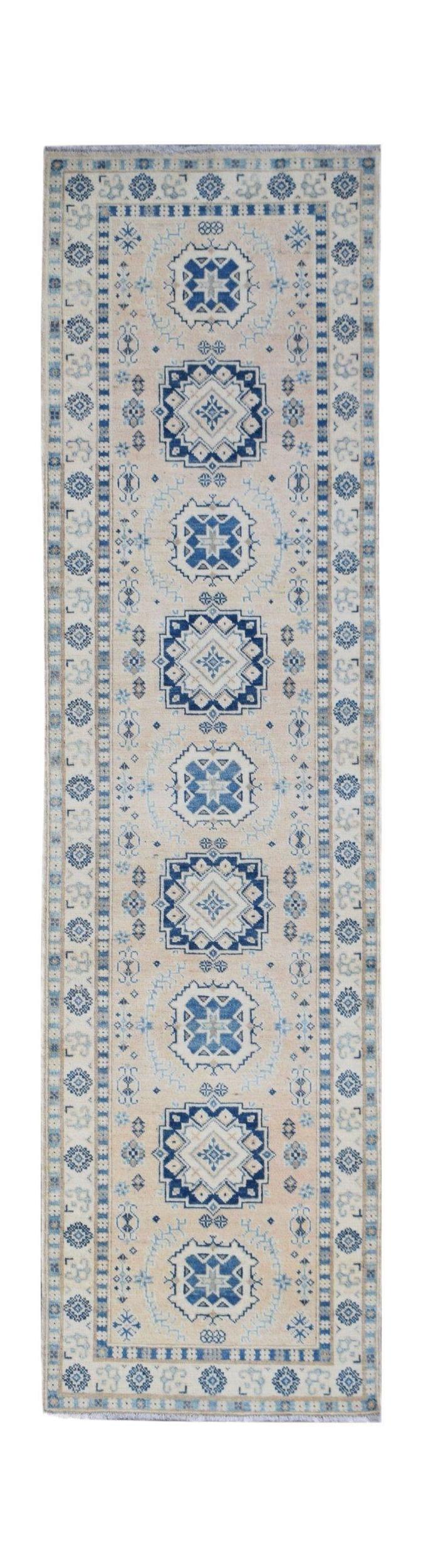 Handmade Afghan Kazakh runner rug featuring blue geometric medallions on a cream wool background.