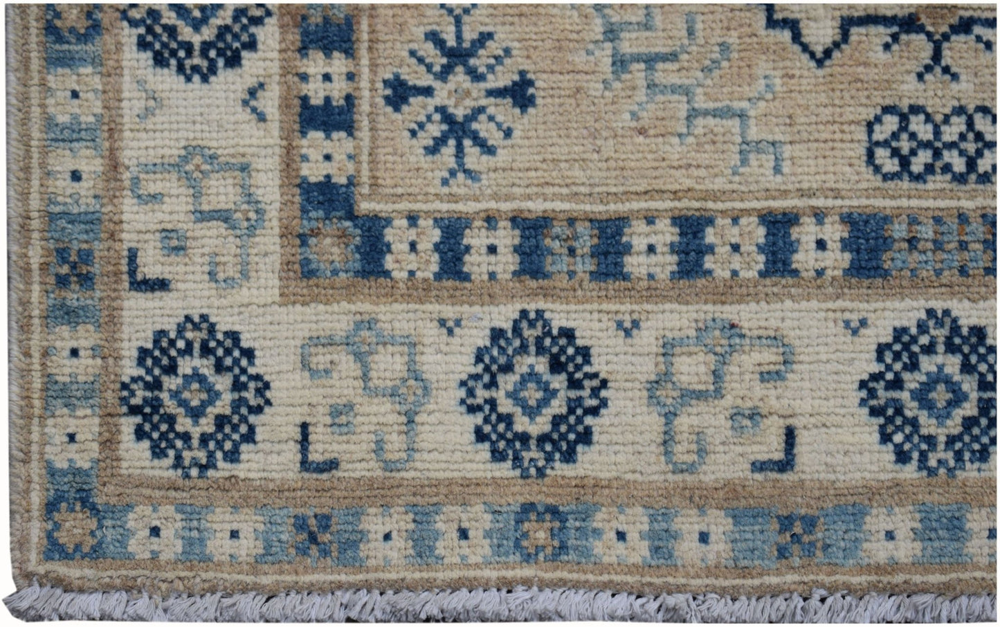 A handmade Afghan Kazakh runner featuring traditional blue geometric patterns on a cream background.