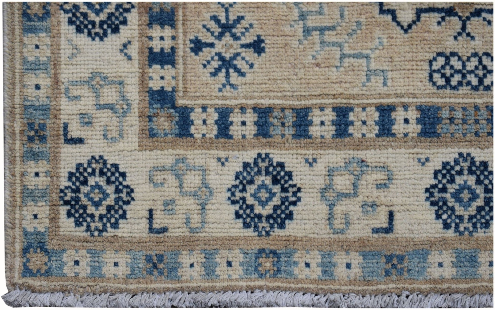 A handmade Afghan Kazakh runner featuring traditional blue geometric patterns on a cream background.