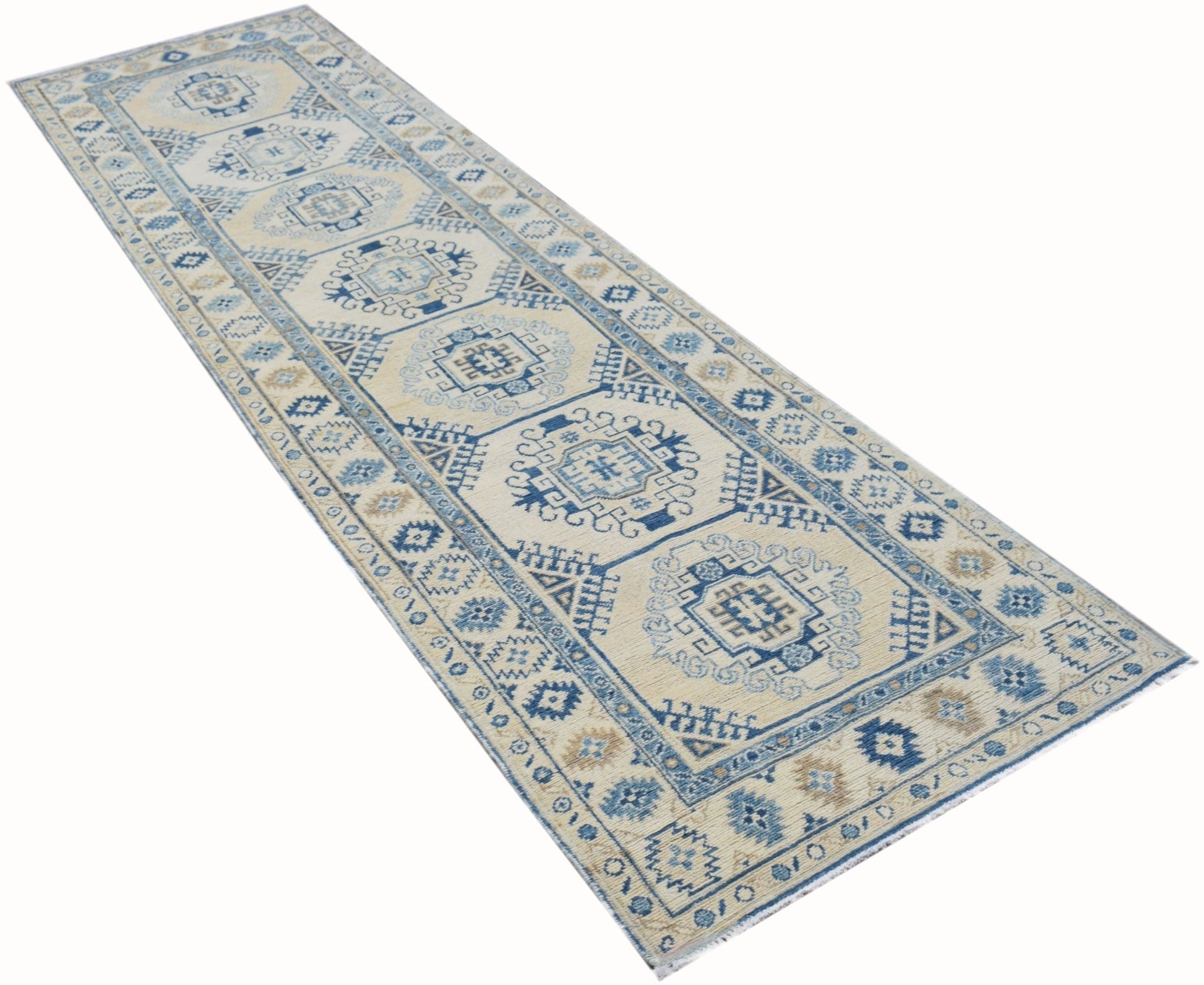 A handmade Afghan Kazakh runner rug featuring traditional blue and beige geometric patterns.