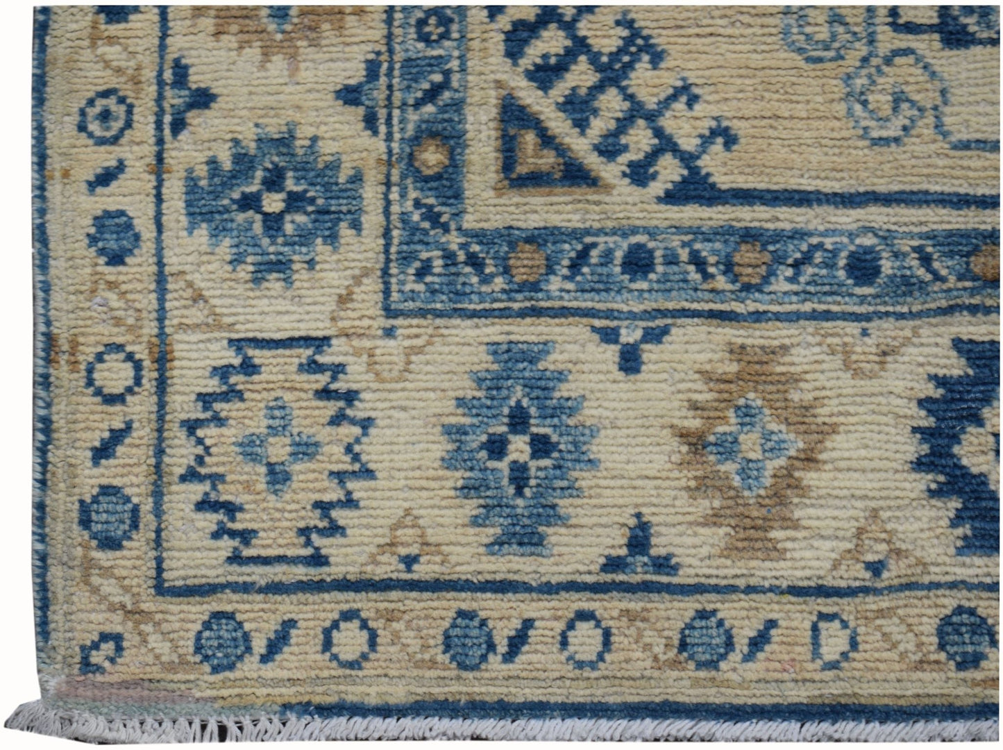 Handmade Afghan Kazakh runner featuring traditional geometric patterns in blue and beige wool.