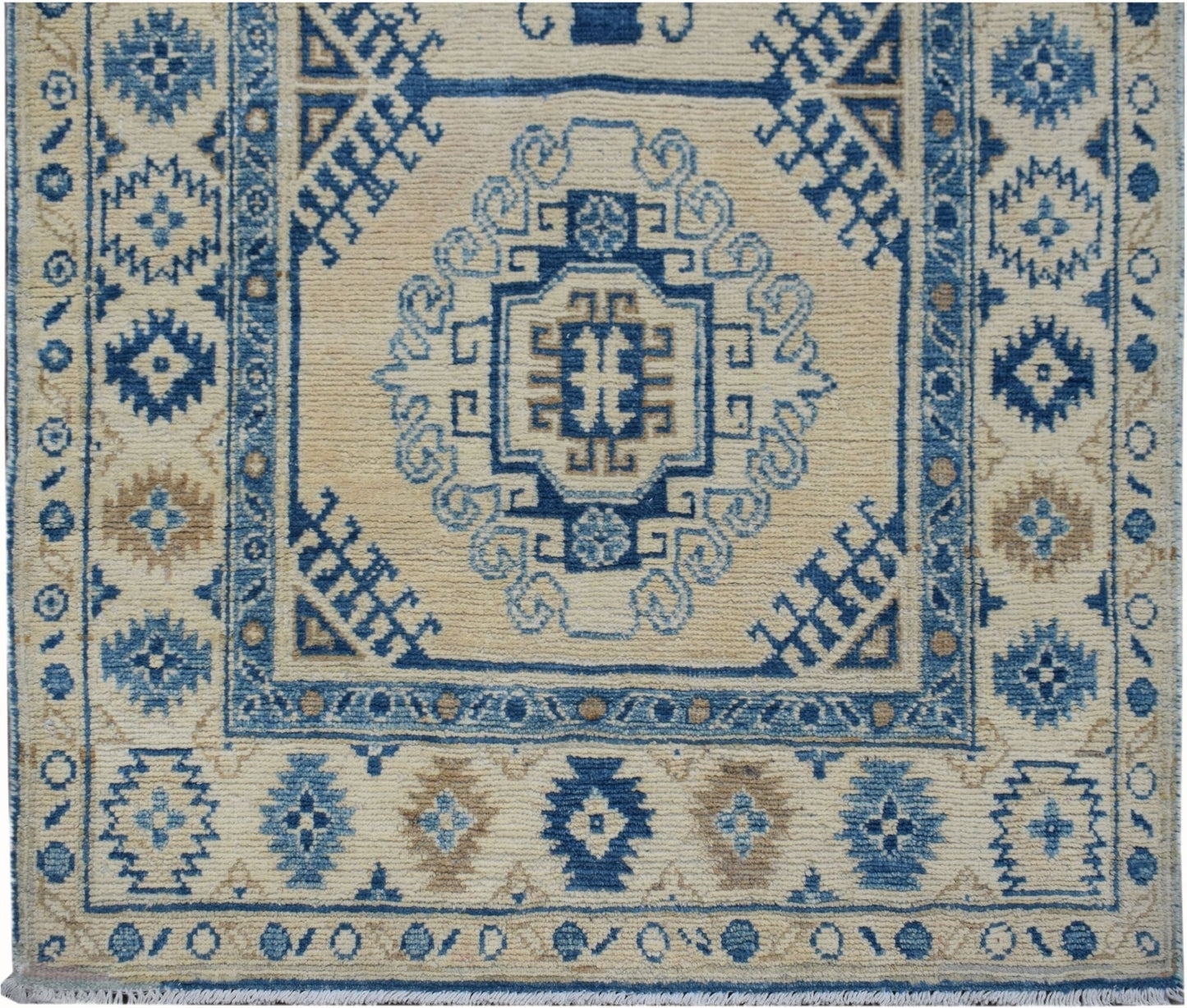 Handmade Afghan Kazakh runner rug featuring traditional blue and beige geometric patterns.