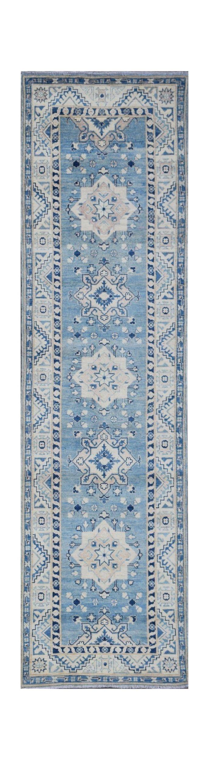 Handmade Afghan Kazakh runner rug featuring a blue field with repeating geometric medallion motifs.