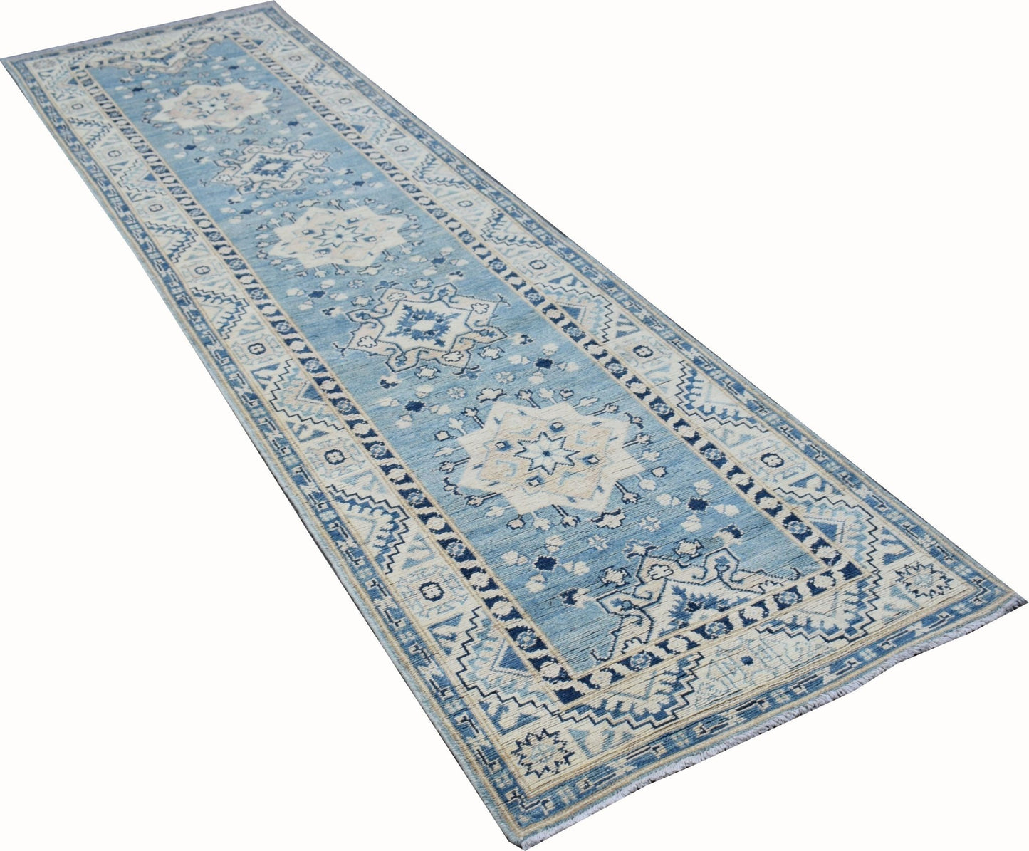A handmade Afghan Kazakh runner rug featuring a blue and beige geometric medallion pattern.