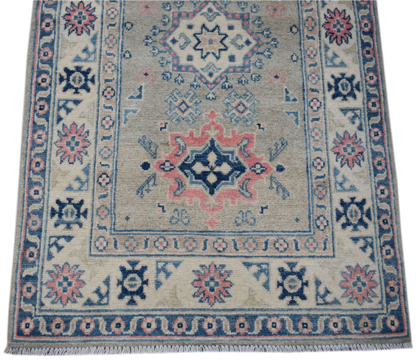 Handmade Afghan Kazakh runner rug featuring traditional geometric motifs in blue, pink, and beige.