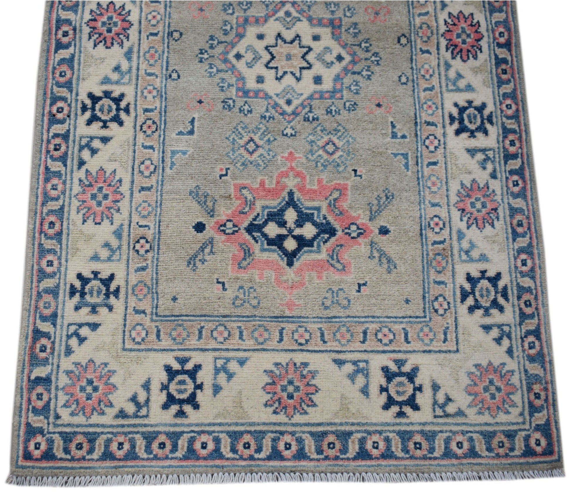 Handmade Afghan Kazakh runner rug featuring traditional geometric motifs in blue, pink, and beige.