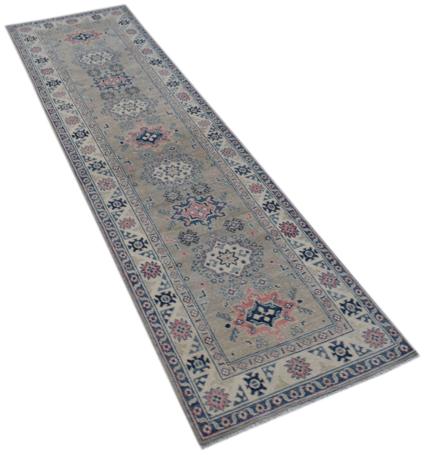 An Afghan Kazakh runner rug featuring traditional geometric motifs in blue, pink, and cream tones.