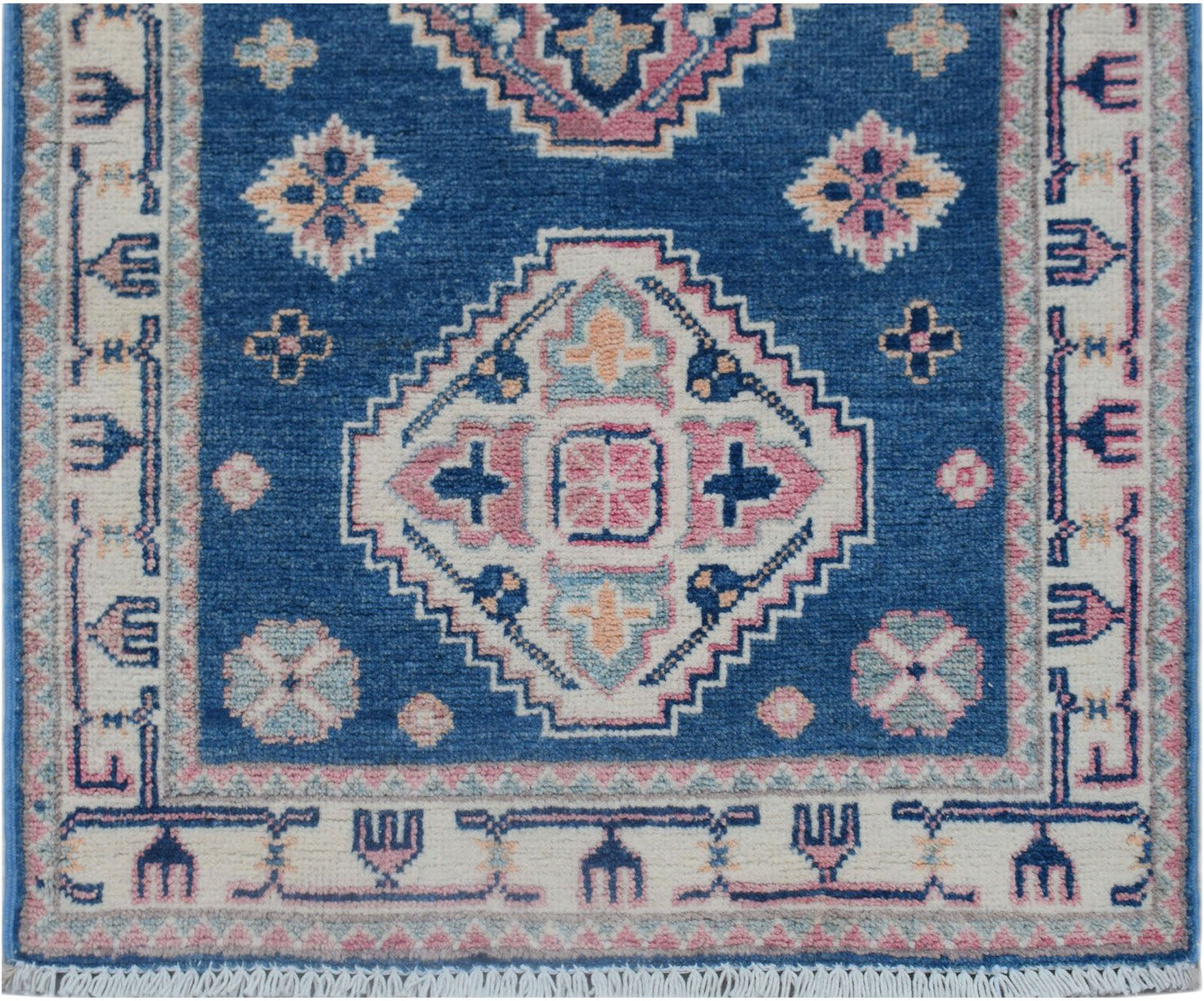 Handmade Afghan Kazakh runner rug featuring traditional geometric motifs in blue, pink, and cream.