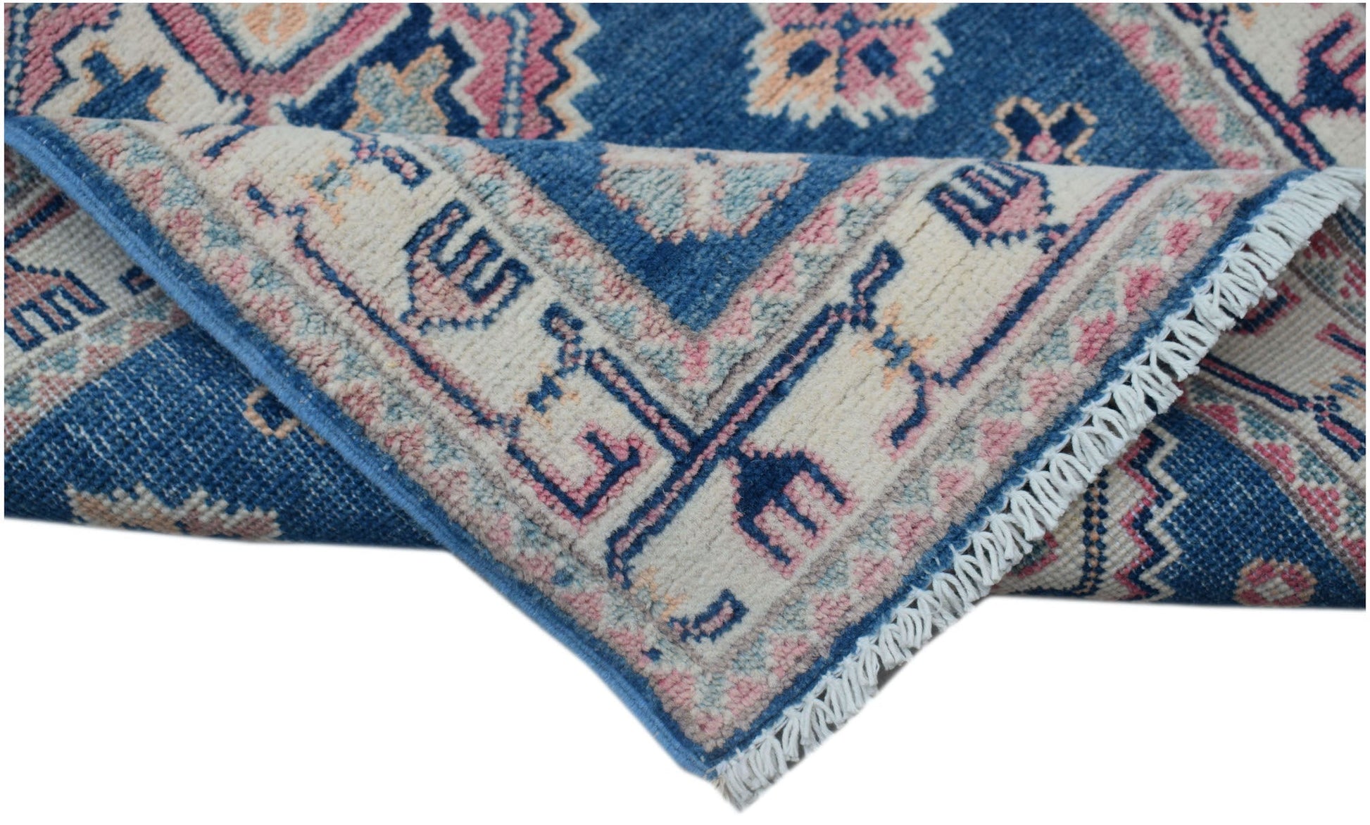 A handmade Afghan Kazakh runner featuring traditional blue, cream, and pink geometric patterns.