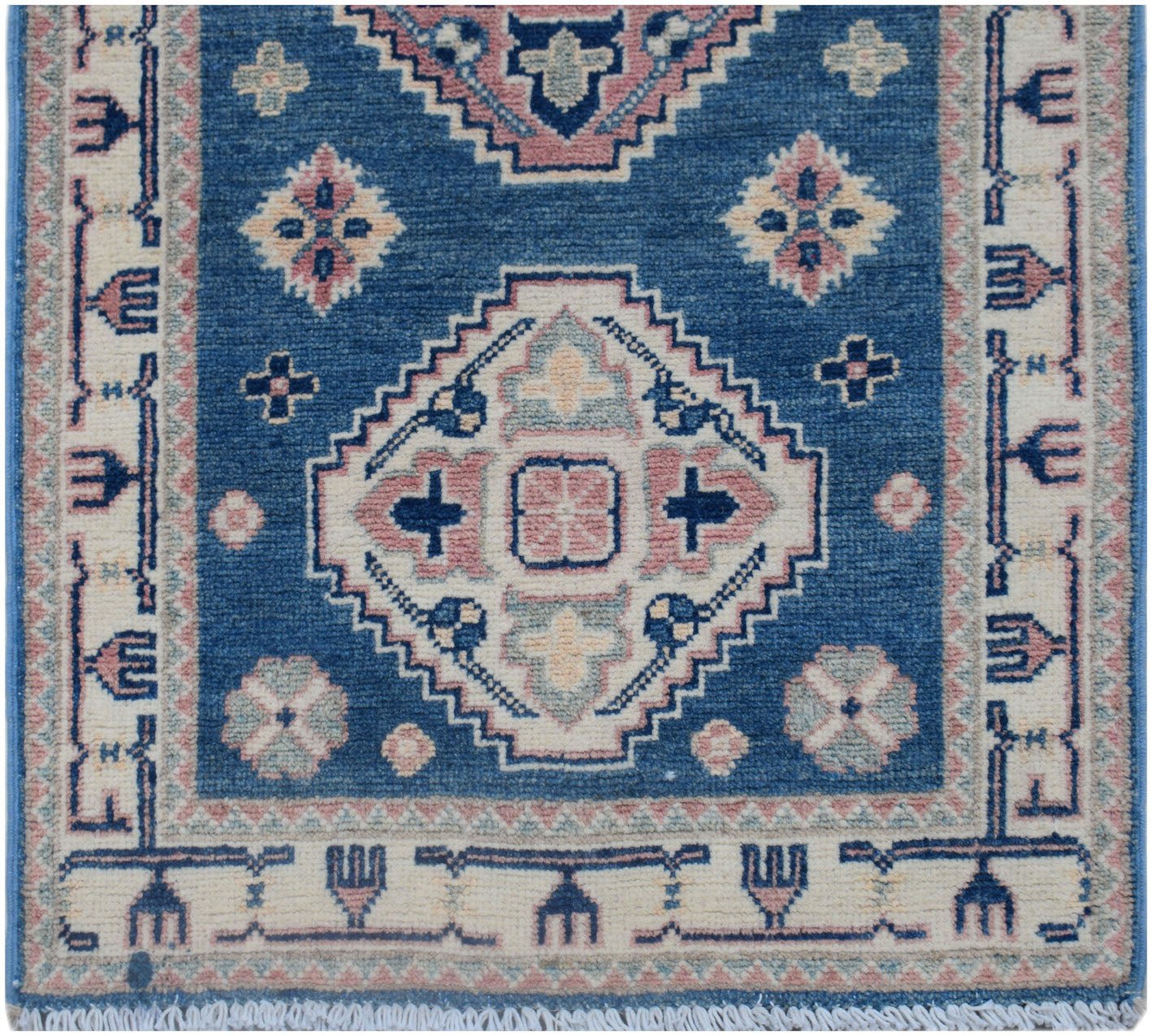 Handmade Afghan Kazakh runner rug featuring traditional geometric motifs in blue and pink tones.