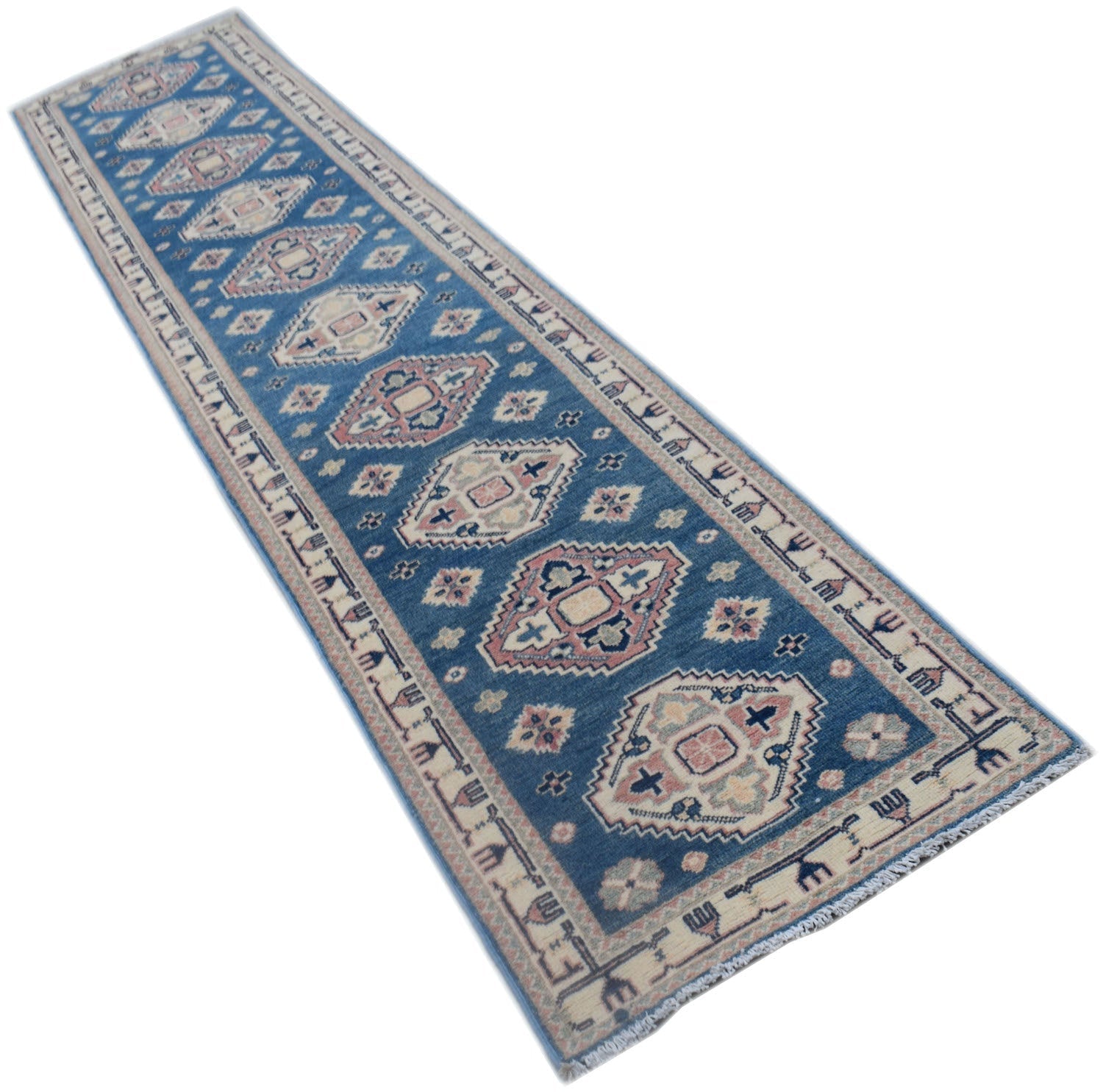 A handmade Afghan Kazakh runner rug featuring traditional geometric motifs in blue and cream.