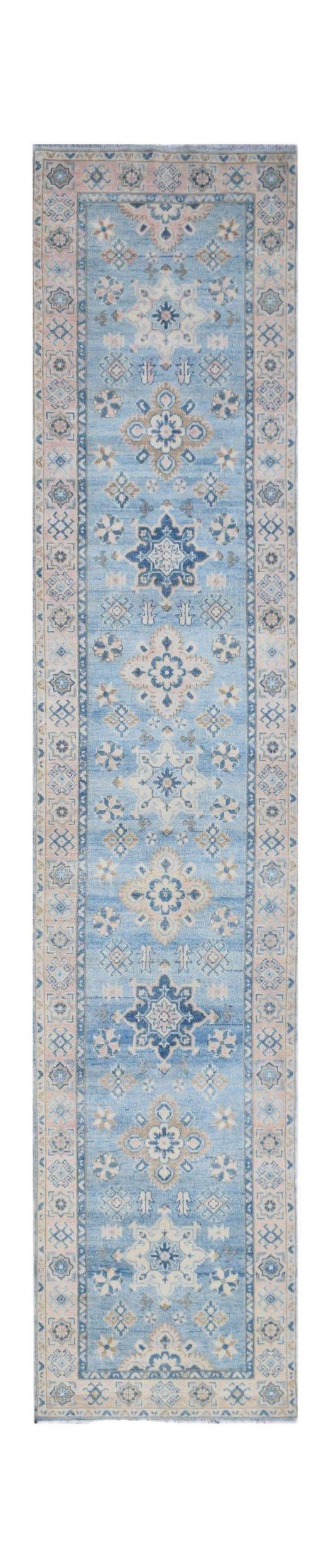 A handmade Afghan Kazakh runner rug featuring traditional geometric patterns in blue and beige.