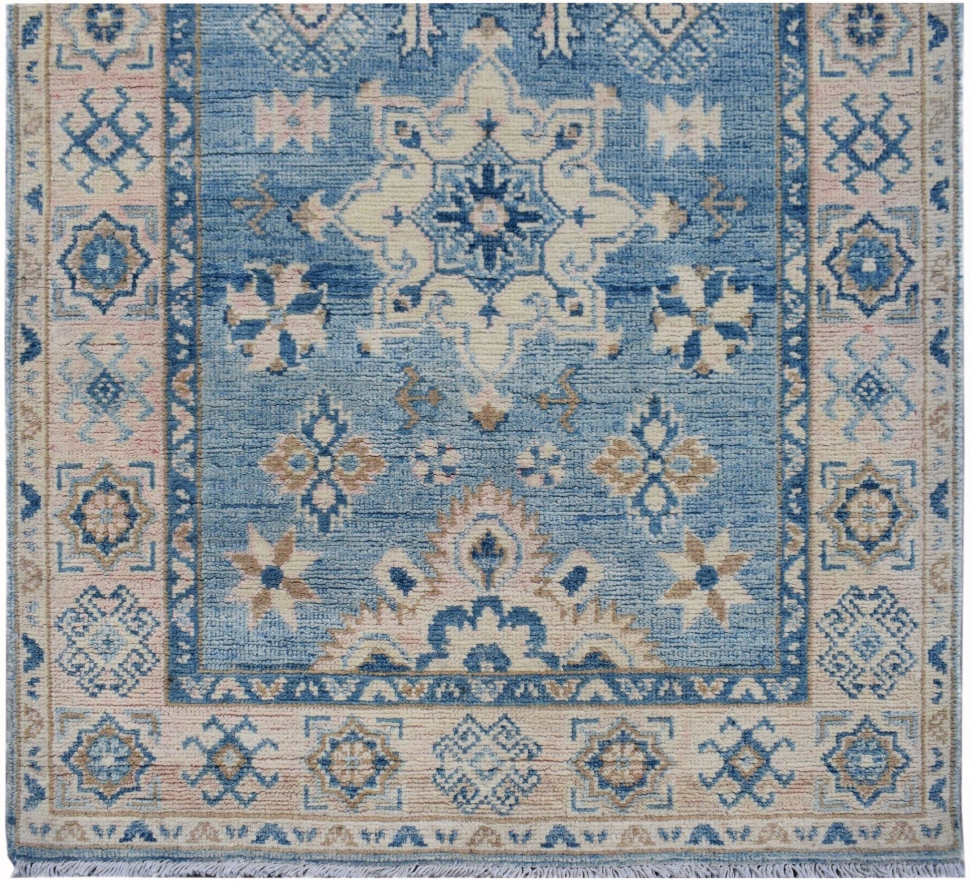 Handmade Afghan Kazakh runner featuring a traditional geometric pattern in blue and beige tones.
