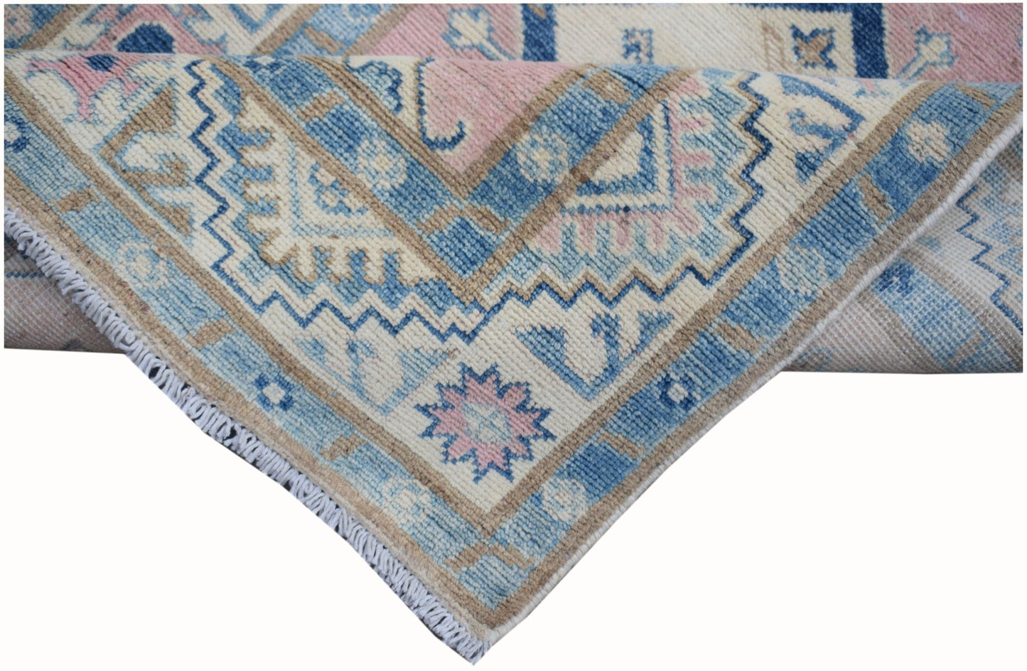 A handmade Afghan Kazakh runner featuring a geometric pattern in shades of blue, pink, and beige.