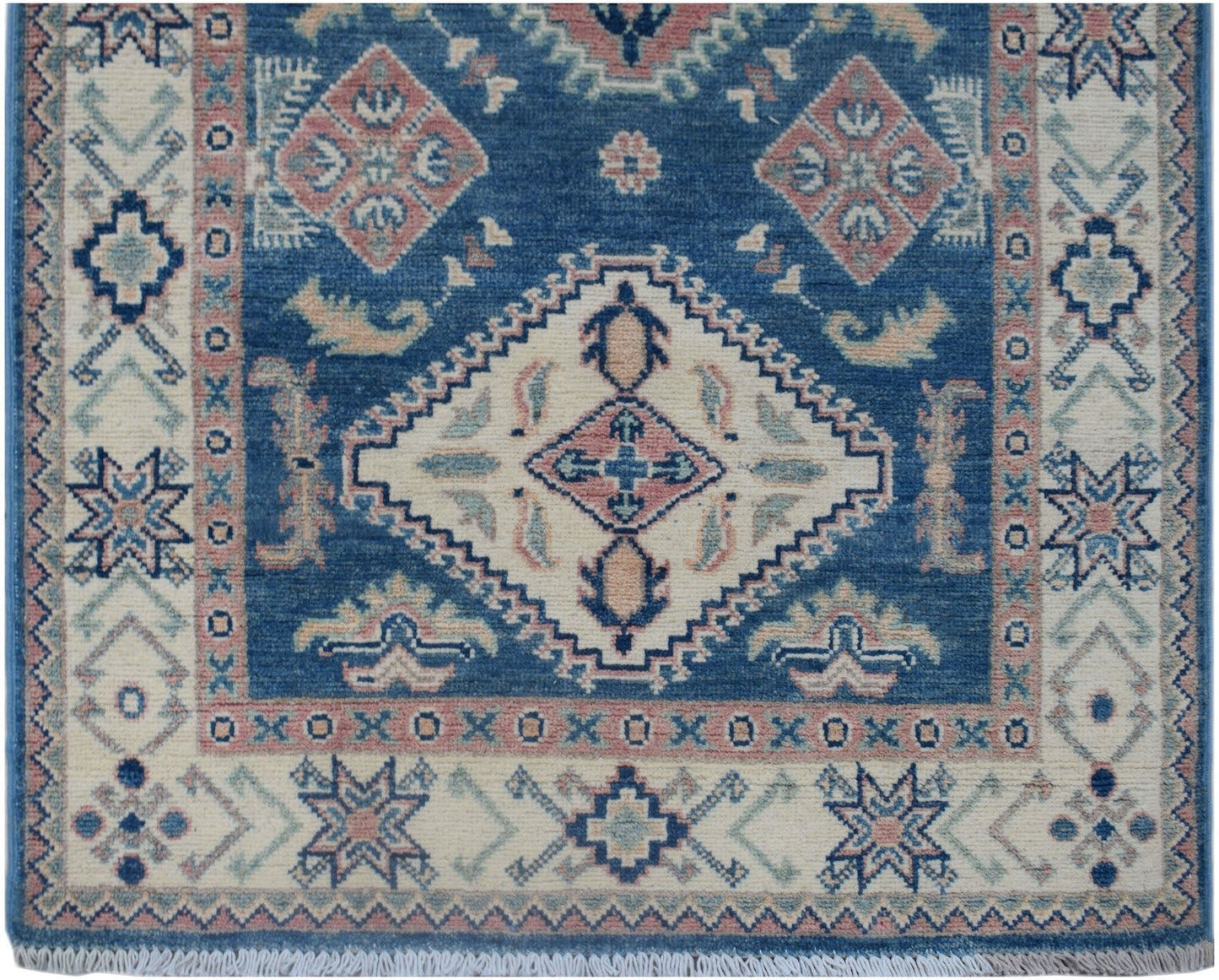 Handmade Afghan Kazakh runner rug featuring a blue field with geometric diamond motifs.