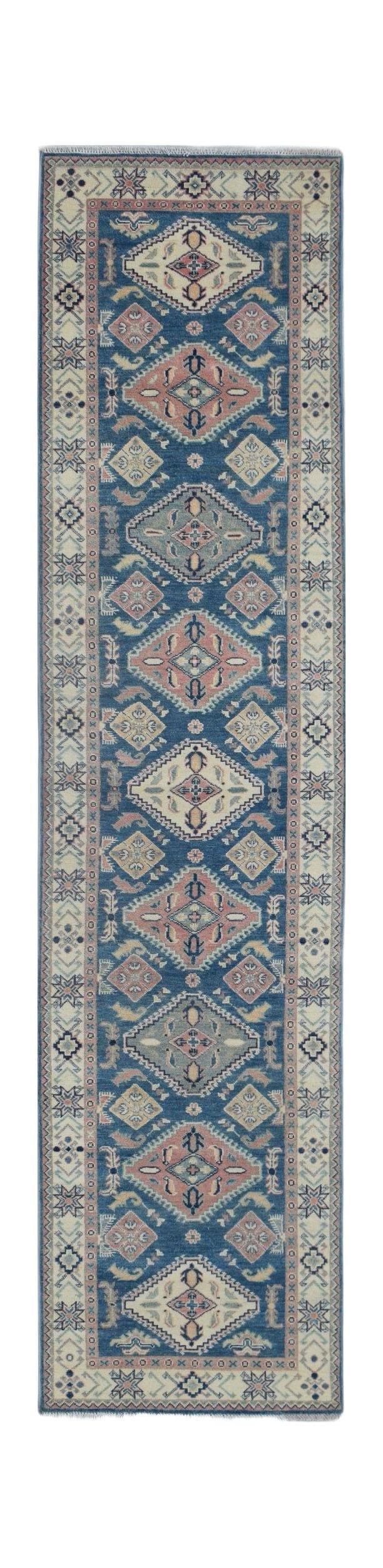A handmade Afghan Kazakh runner rug featuring traditional geometric motifs in blue, pink, and cream.