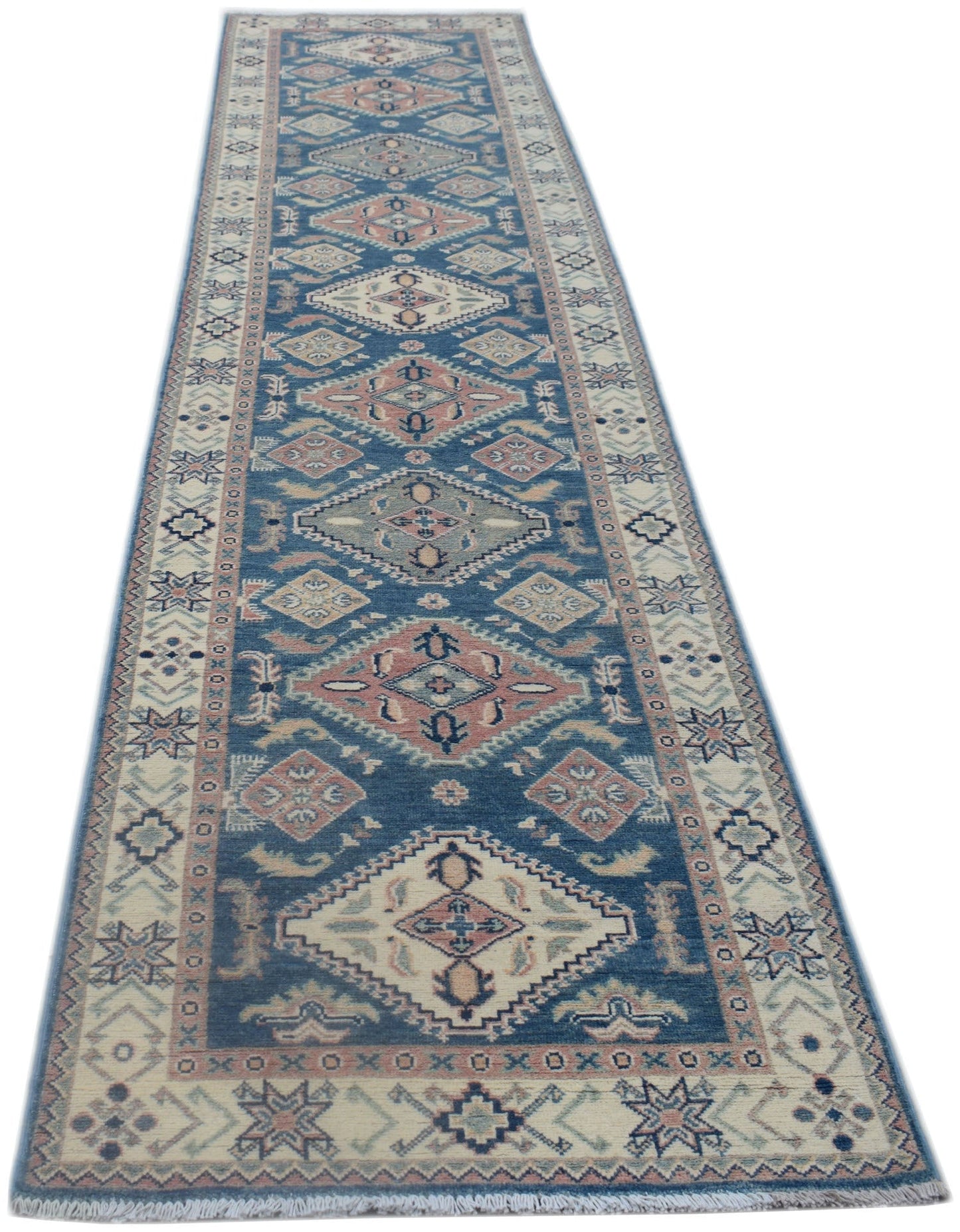 A handmade Afghan Kazakh runner rug featuring traditional geometric diamond motifs in blue and pink.