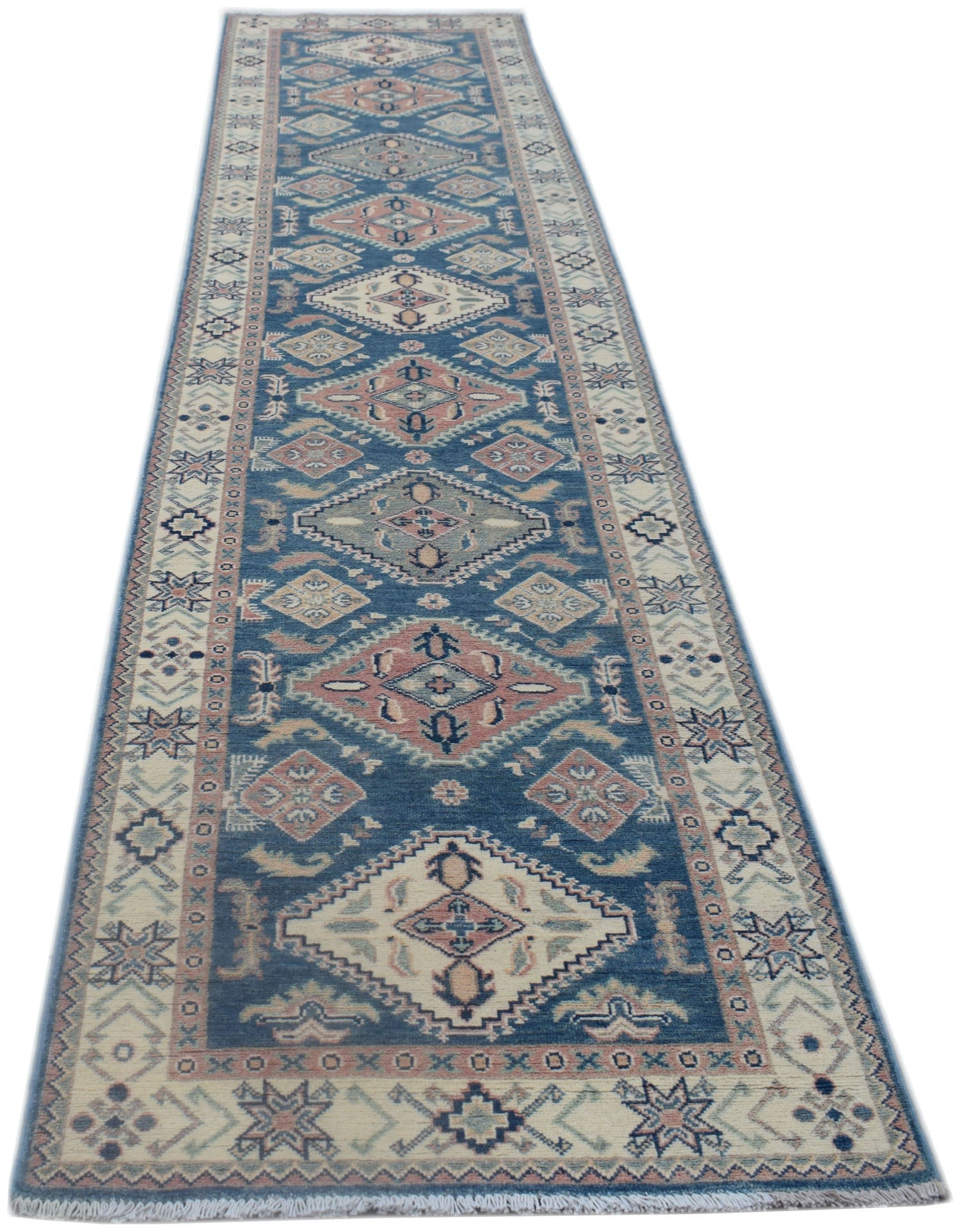 A handmade Afghan Kazakh runner rug featuring traditional geometric diamond motifs in blue and pink.