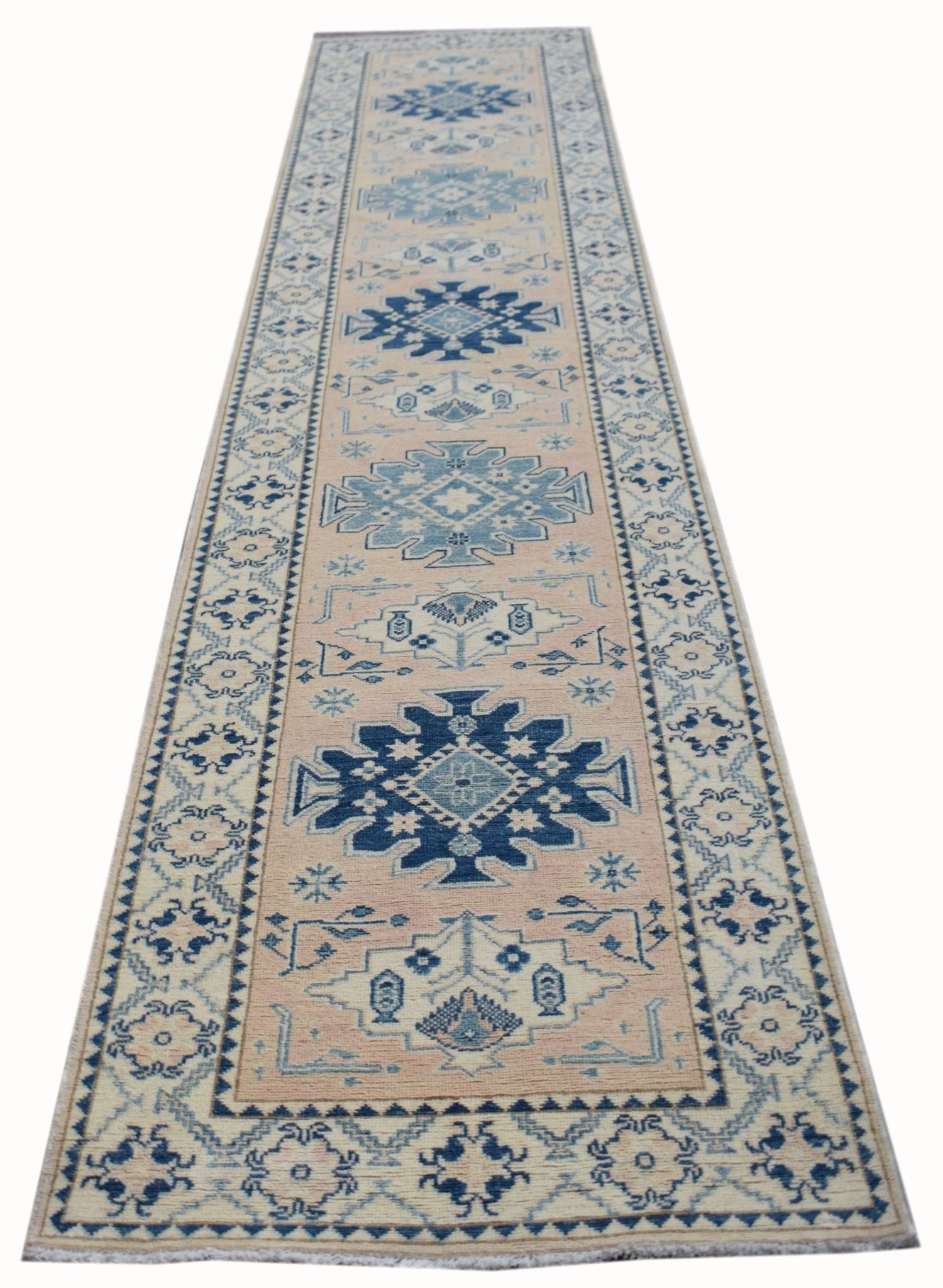 Handmade Afghan Kazakh runner rug featuring a geometric pattern in blue and beige tones.
