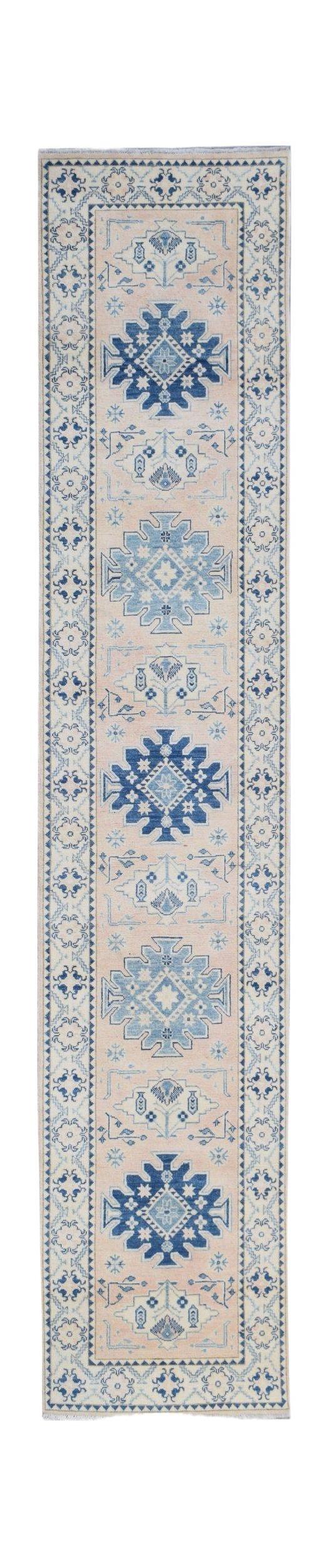 Handmade Afghan Kazakh runner rug featuring blue geometric medallions on a beige wool field.