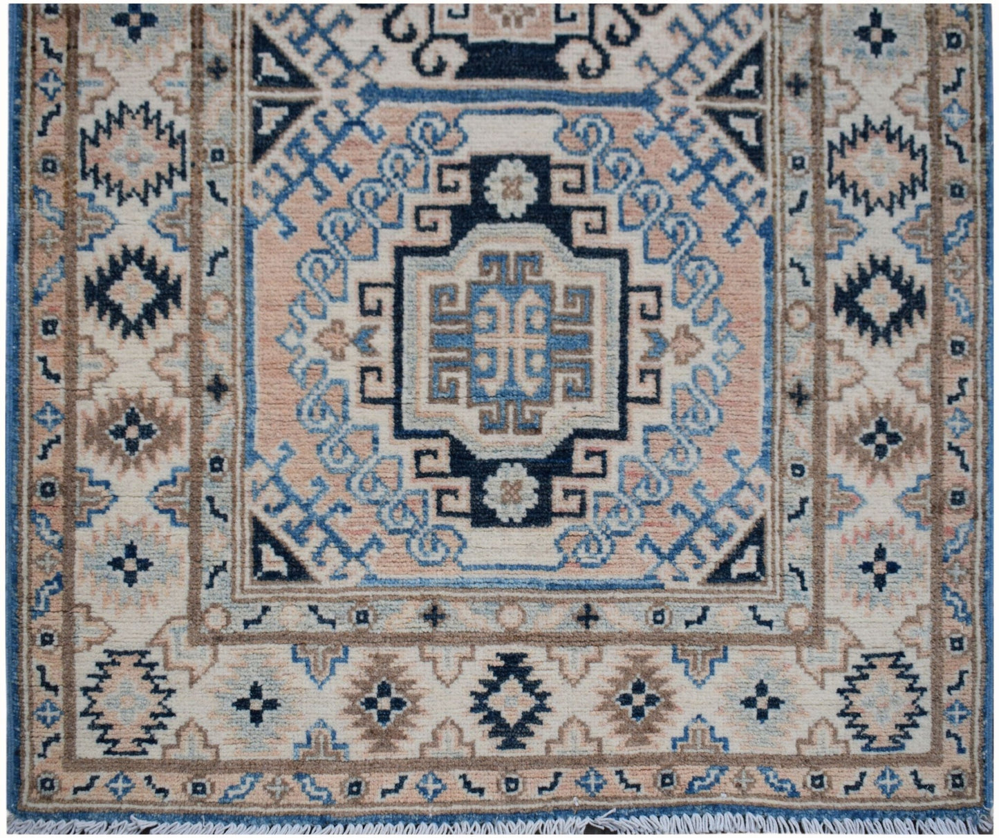 Handmade Afghan Kazakh runner rug featuring a geometric medallion pattern in blue and beige.