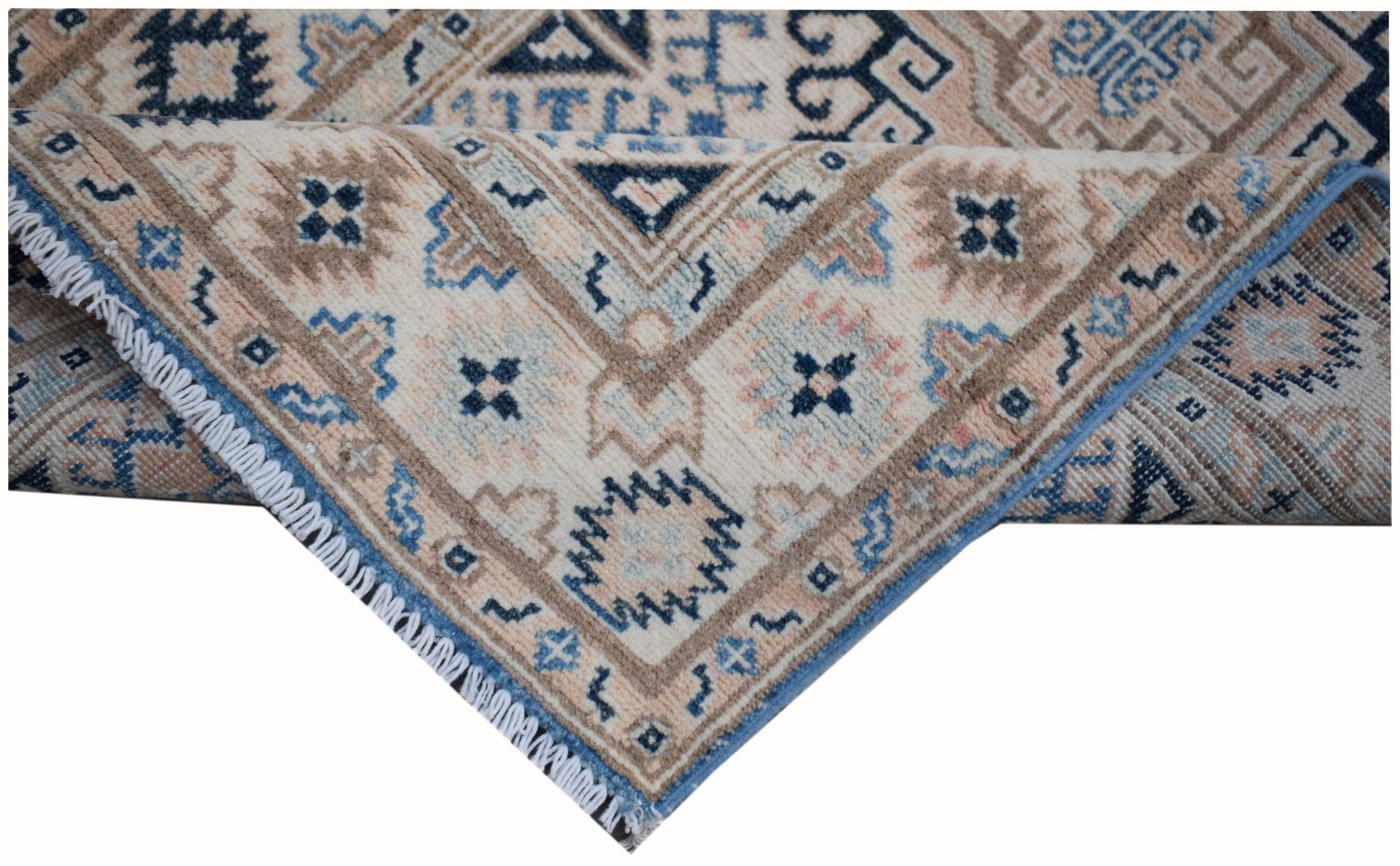 Handmade Afghan Kazakh runner rug featuring a geometric pattern in beige, blue, and grey tones.