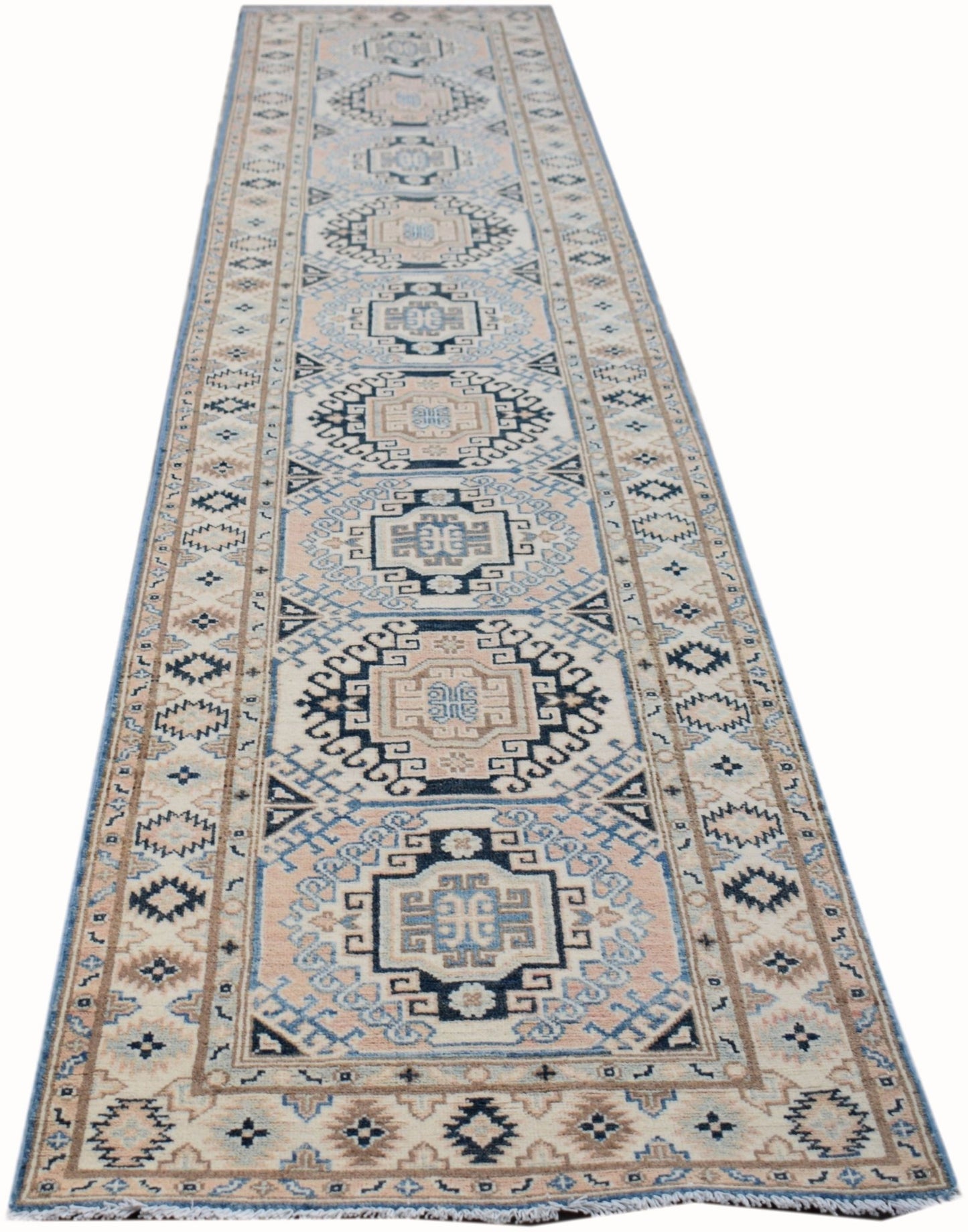 A handmade Afghan Kazakh runner rug featuring a geometric pattern in shades of beige and blue.