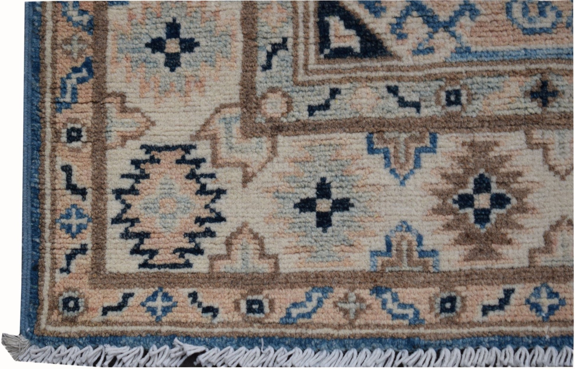 Handmade Afghan Kazakh runner rug featuring geometric patterns in beige, blue, and grey tones.