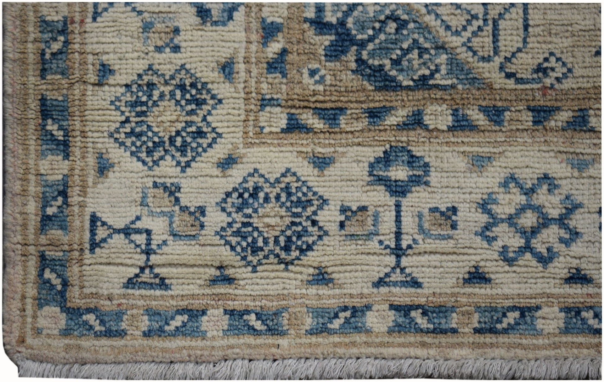 A handmade Afghan Kazakh runner rug featuring a beige field with blue geometric floral patterns.