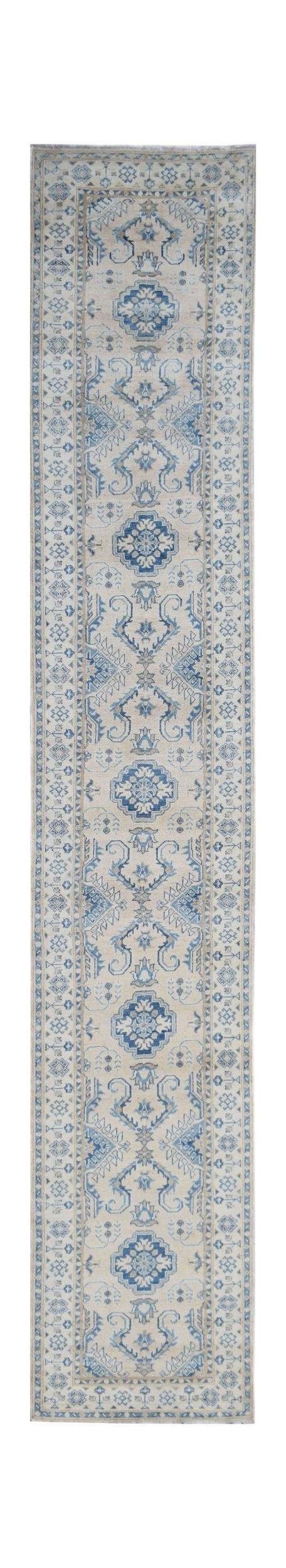 Handmade Afghan Kazakh runner rug featuring a traditional blue and beige geometric pattern.