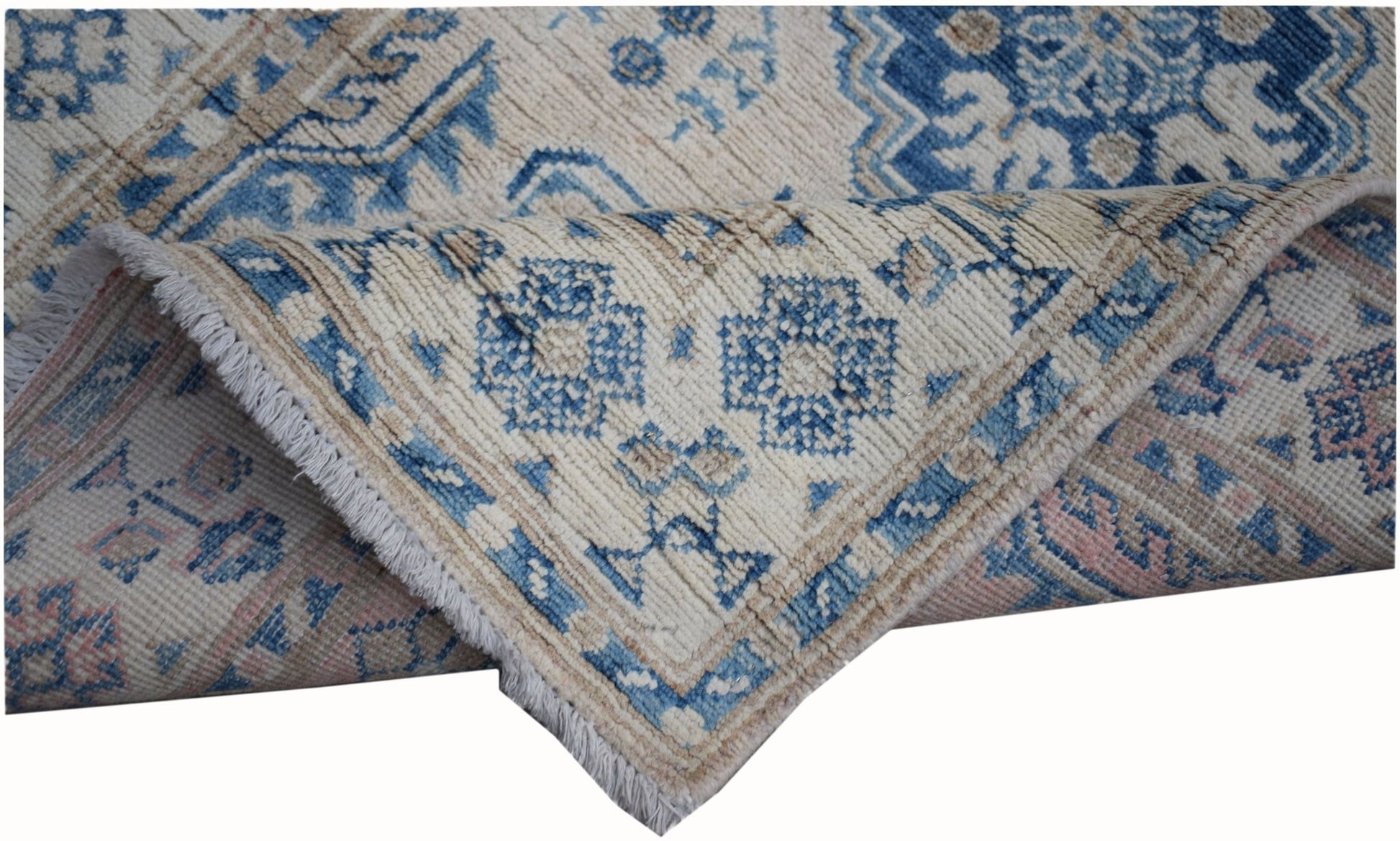 An Afghan Kazakh runner rug featuring a beige background with blue and grey geometric patterns.