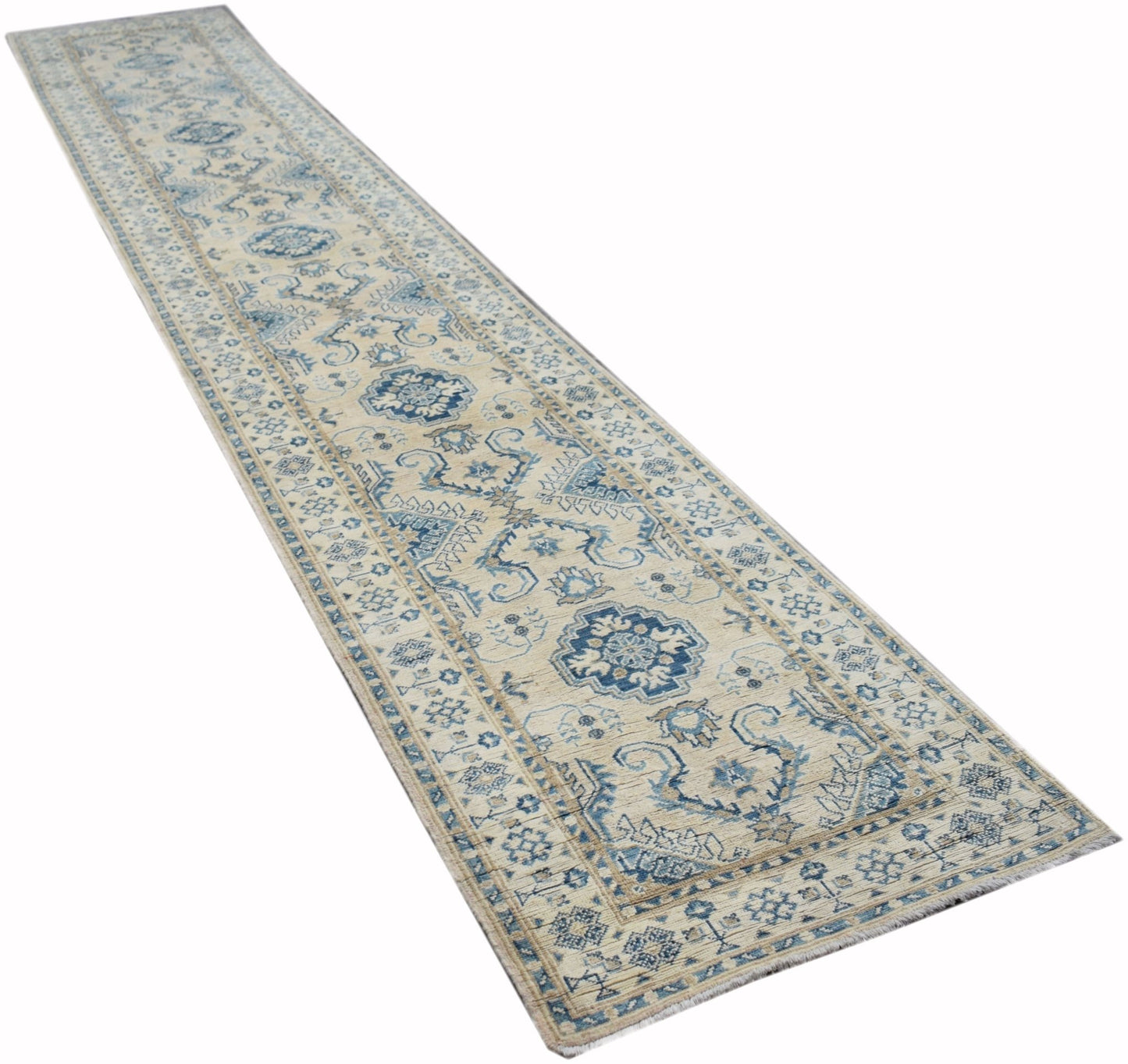 A handmade Afghan Kazakh runner rug featuring a traditional blue and beige geometric pattern.