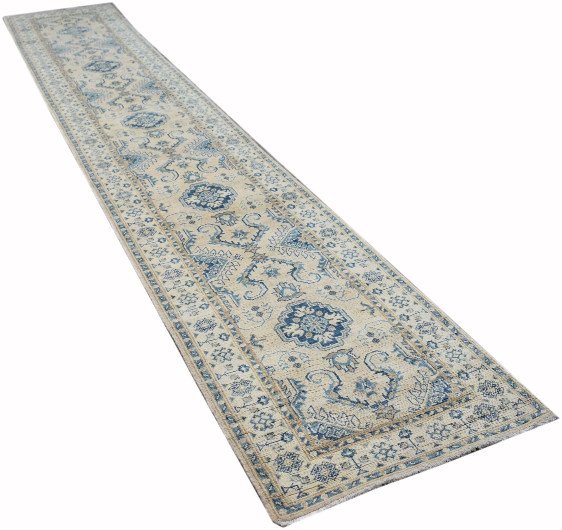 A handmade Afghan Kazakh runner rug featuring a traditional blue and beige geometric pattern.