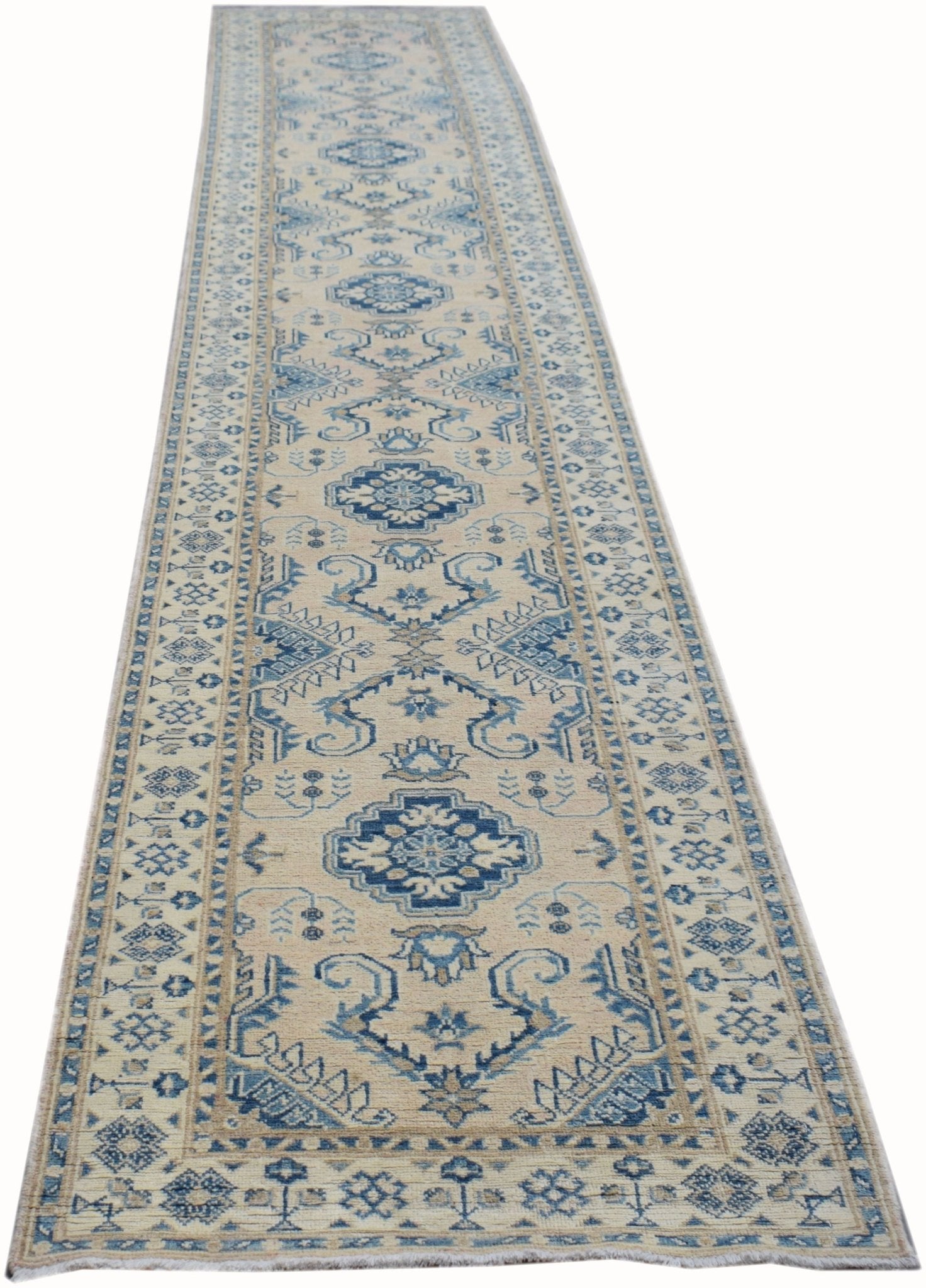 A handmade Afghan Kazakh runner rug featuring a traditional blue and beige geometric pattern.