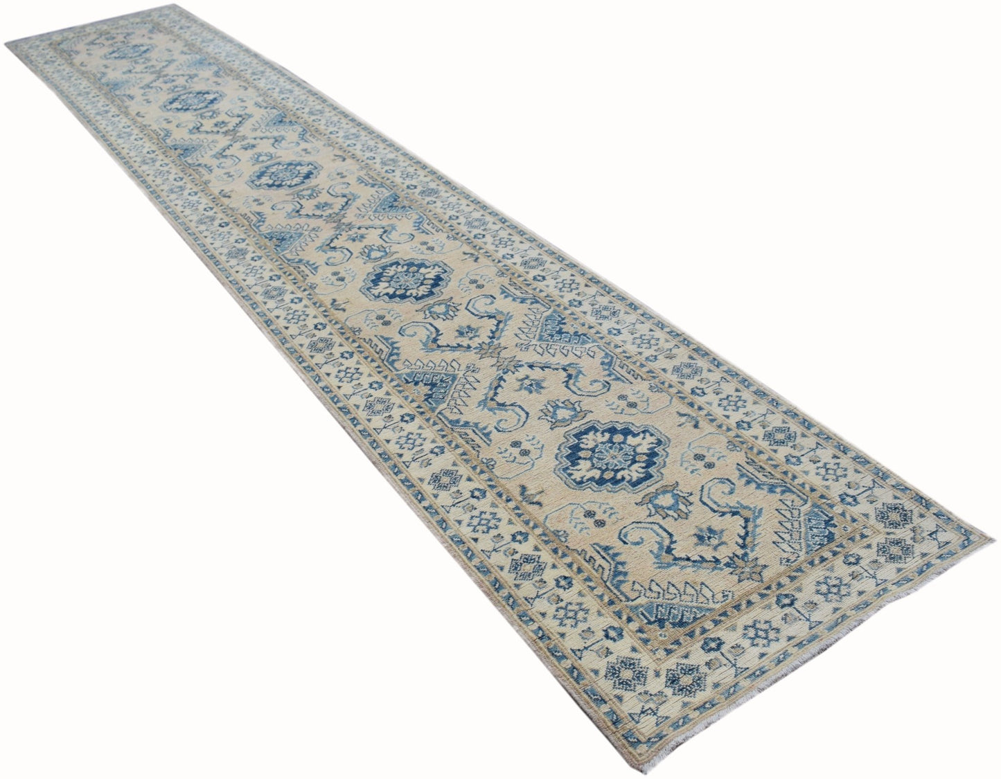 A handmade Afghan Kazakh runner rug featuring a traditional blue and beige geometric pattern.